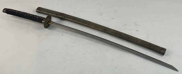 A Katana style sword in a painted wooden sheath with...