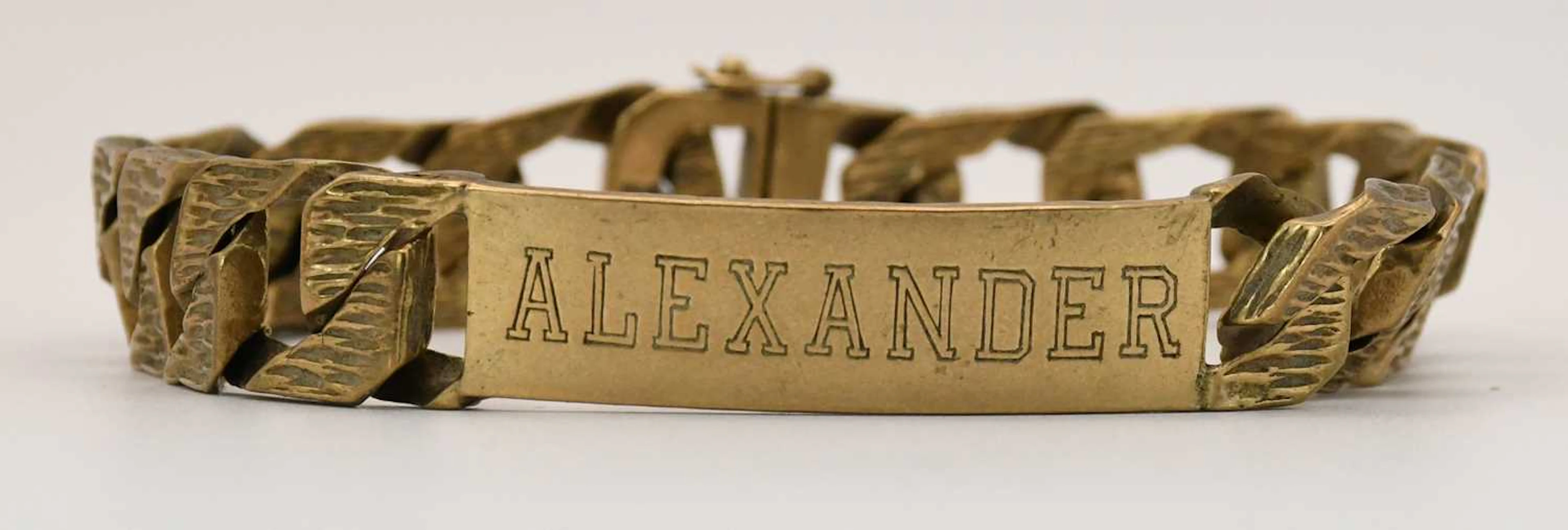 A 9ct yellow gold flat Cuban link identity bracelet