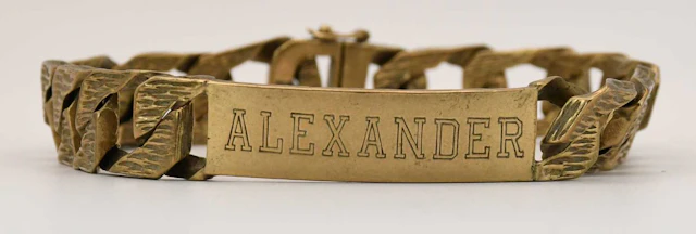 A 9ct yellow gold flat Cuban link identity bracelet