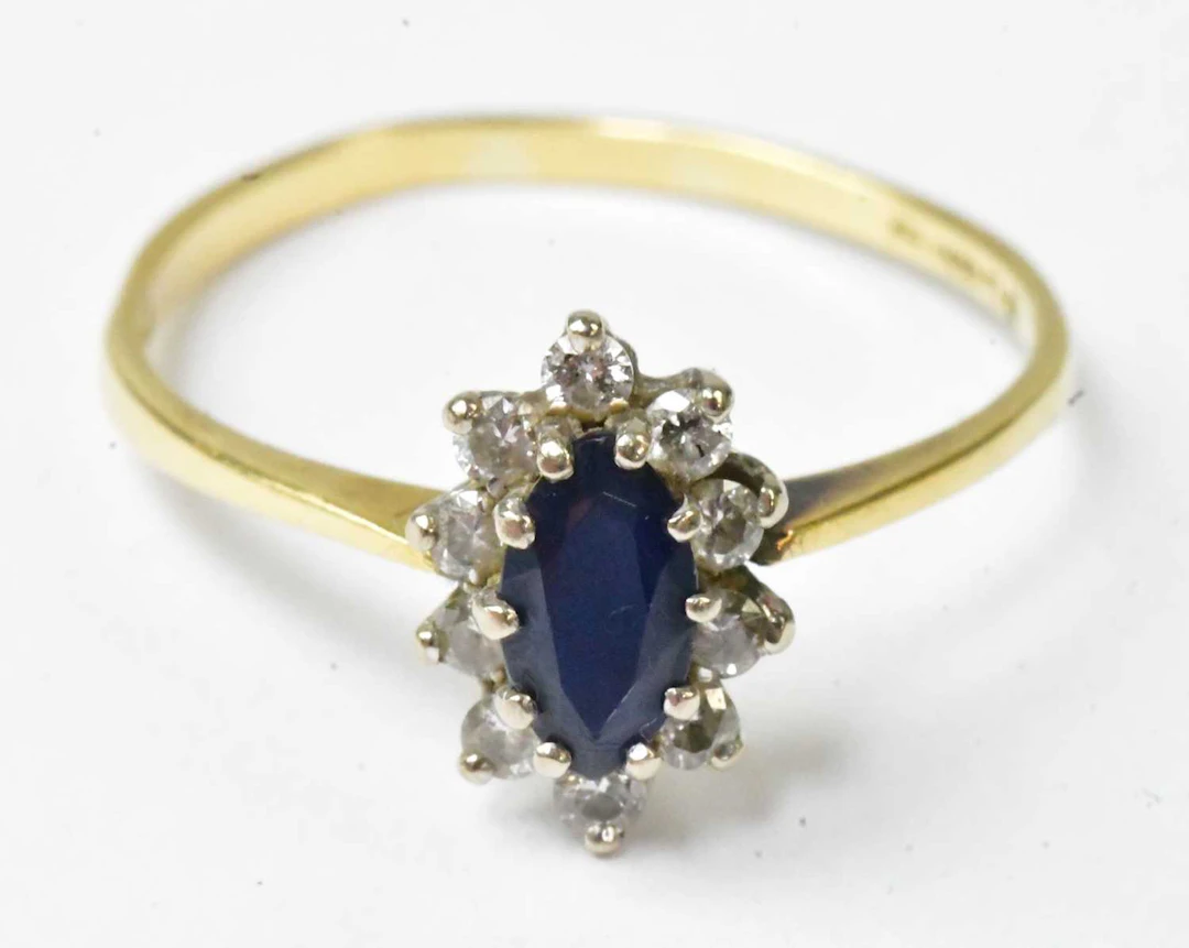 An 18ct yellow gold ring set with a marquise-shaped...