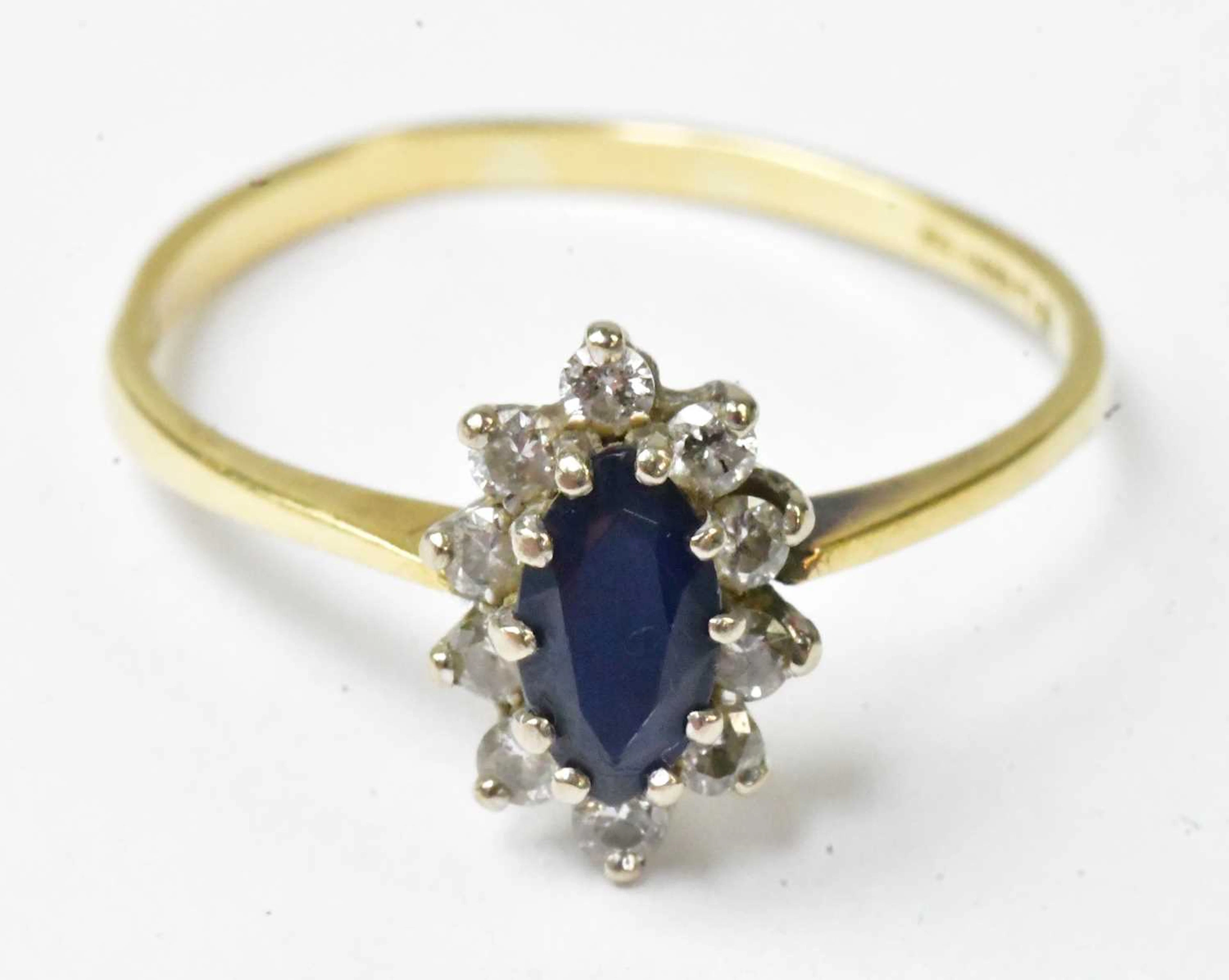 An 18ct yellow gold ring set with a marquise-shaped...