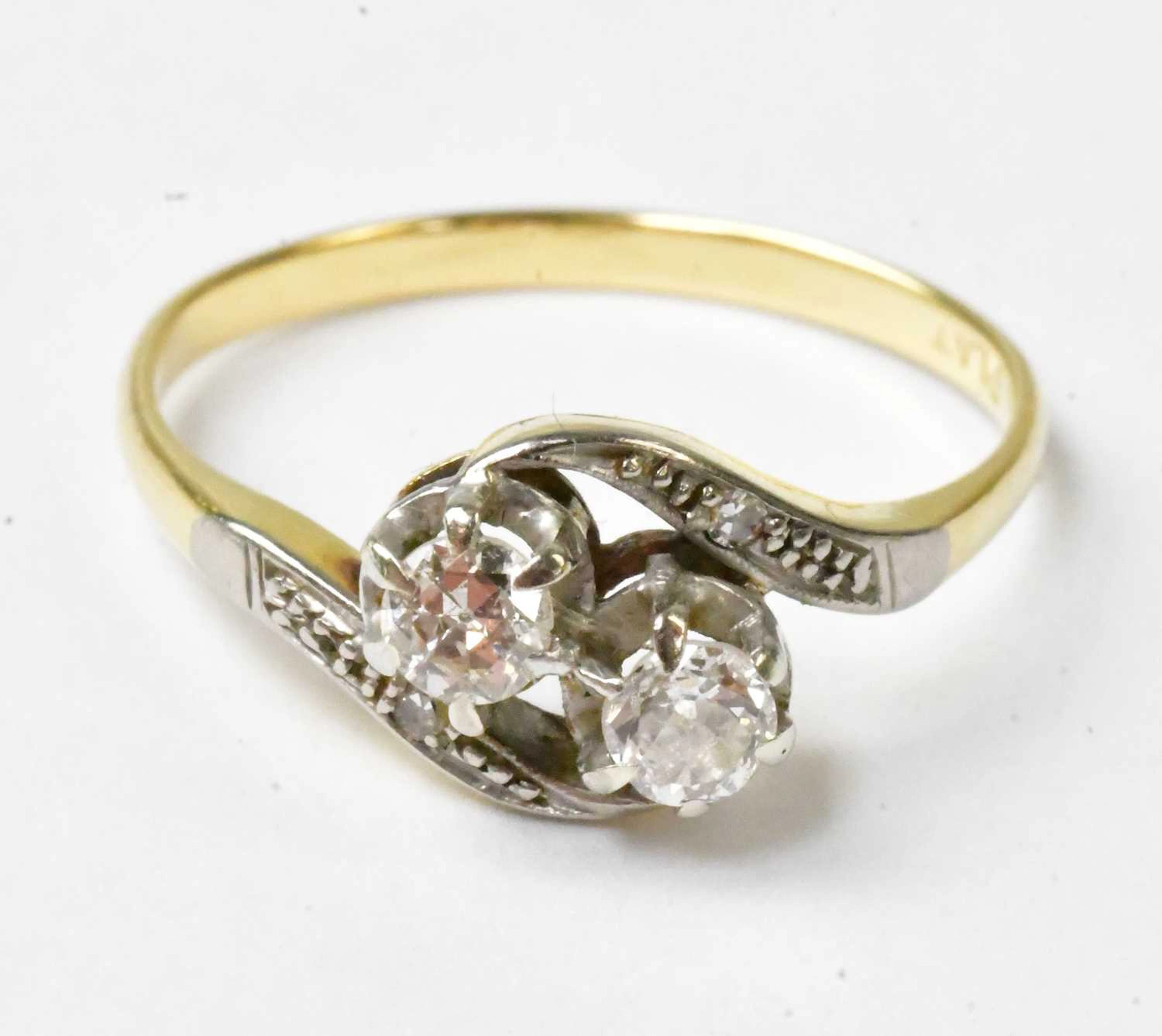 An 18ct yellow gold and platinum ring set with two diamonds