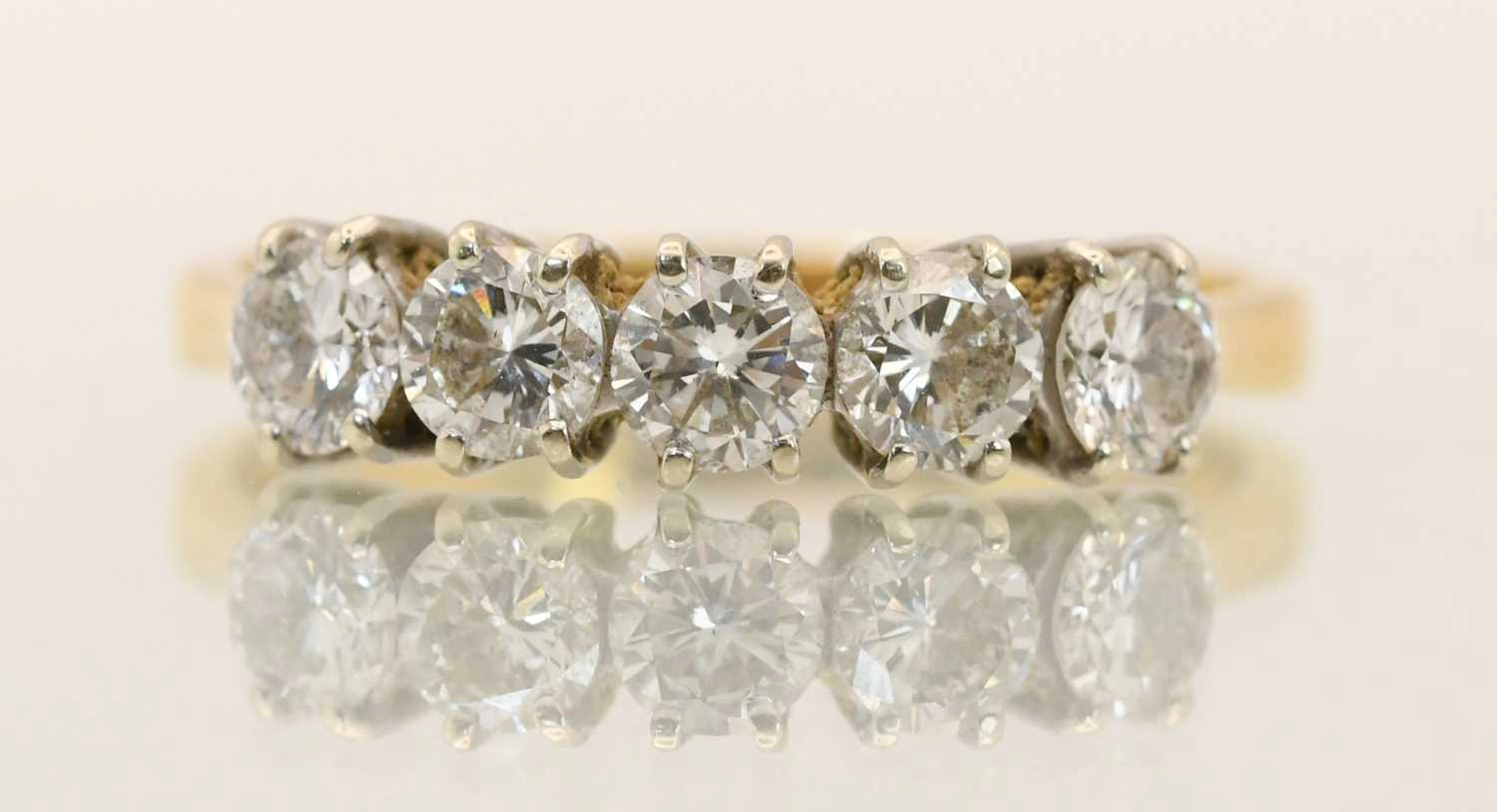 An 18ct yellow gold diamond set five stone ring