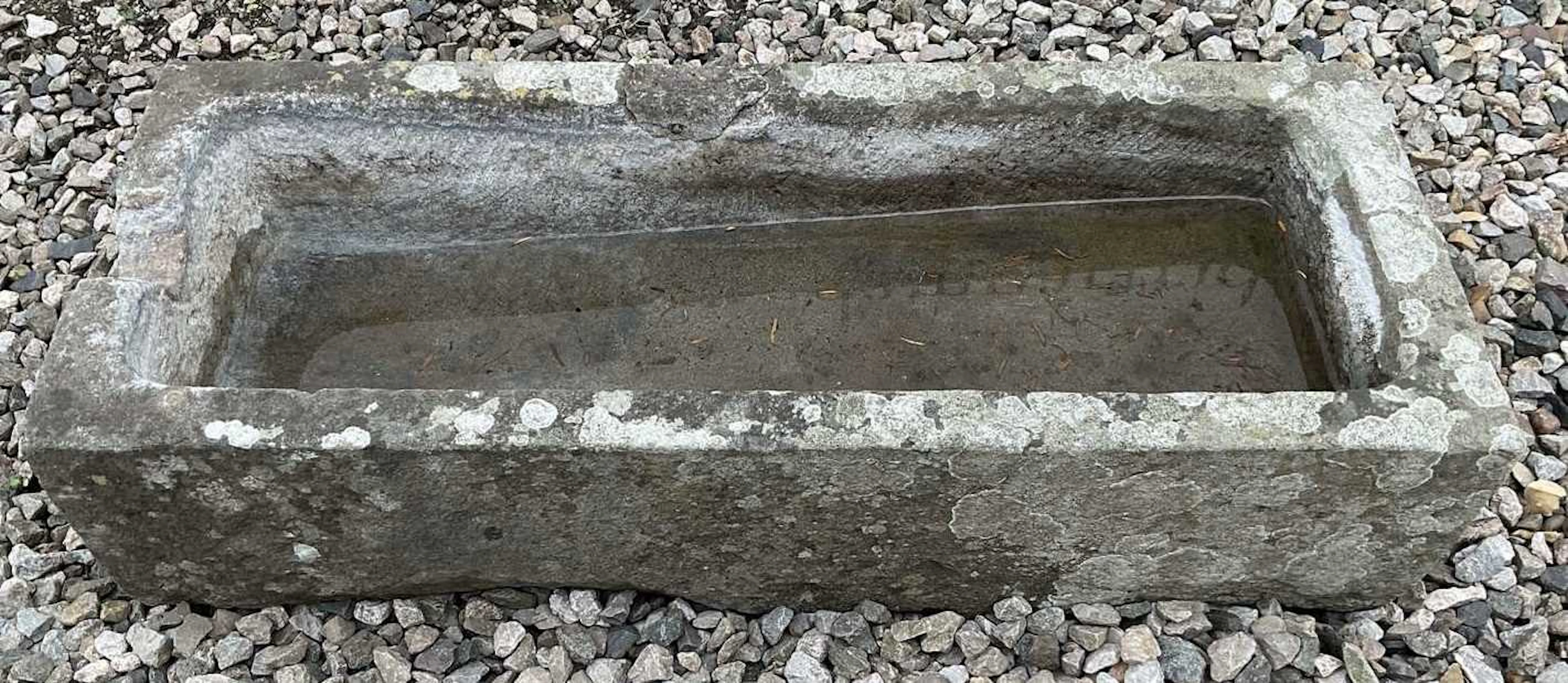 A composite stone water trough