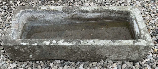 A composite stone water trough