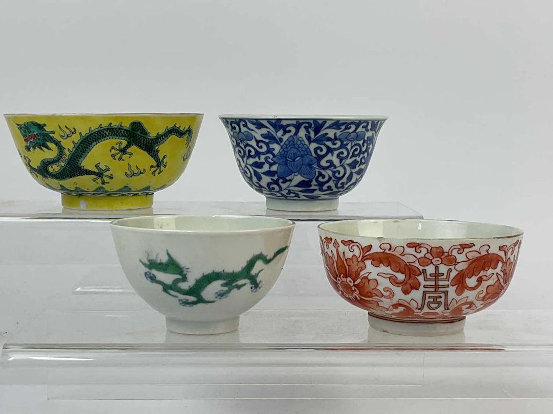A Chinese yellow ground bowl decorated with dragons to the exterior and interior
