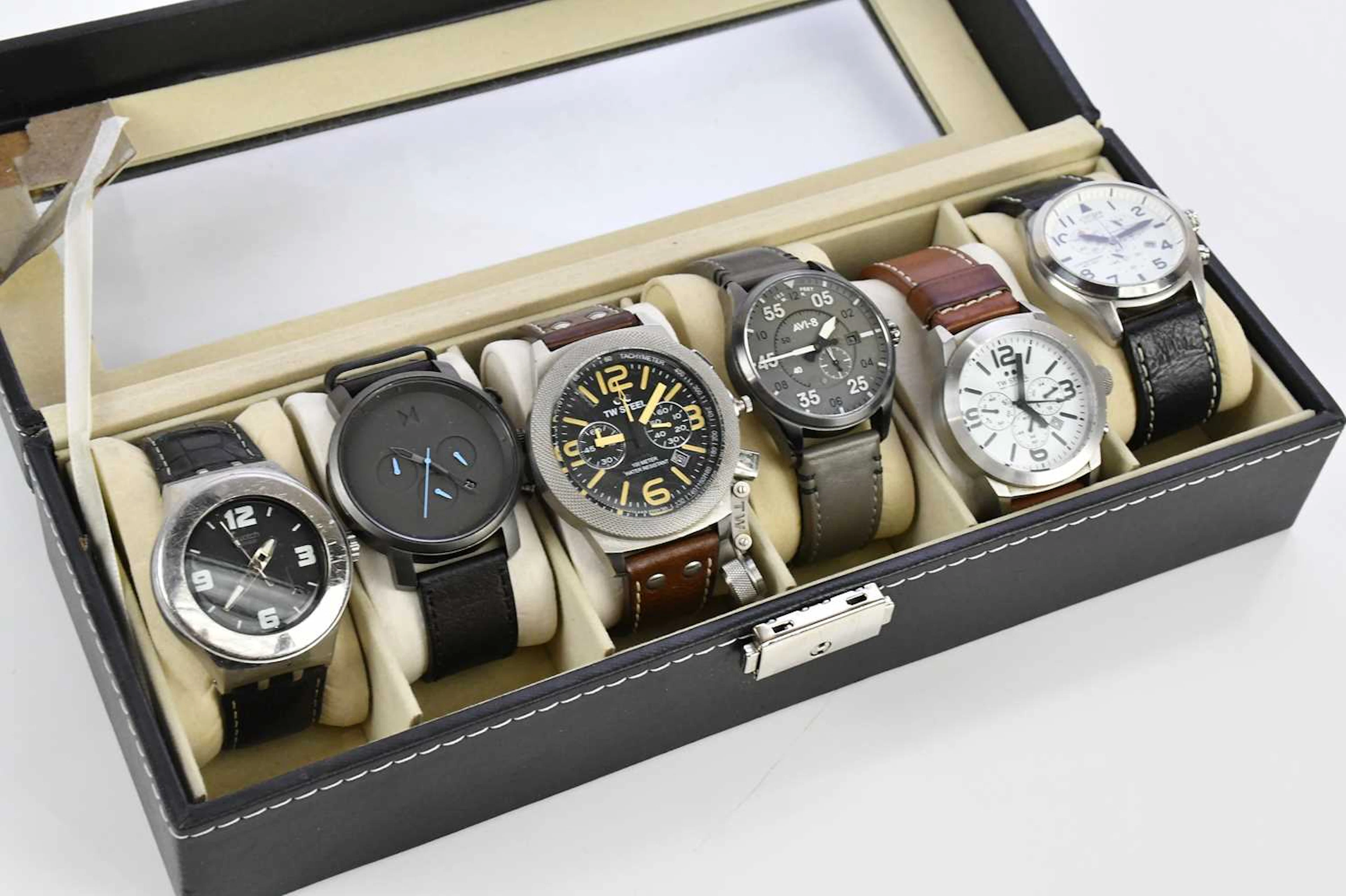 A collection of six fashion watches including Swatch