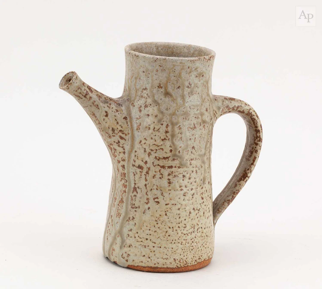 DAN ARBEID (1928-2010); a stoneware jug covered in...