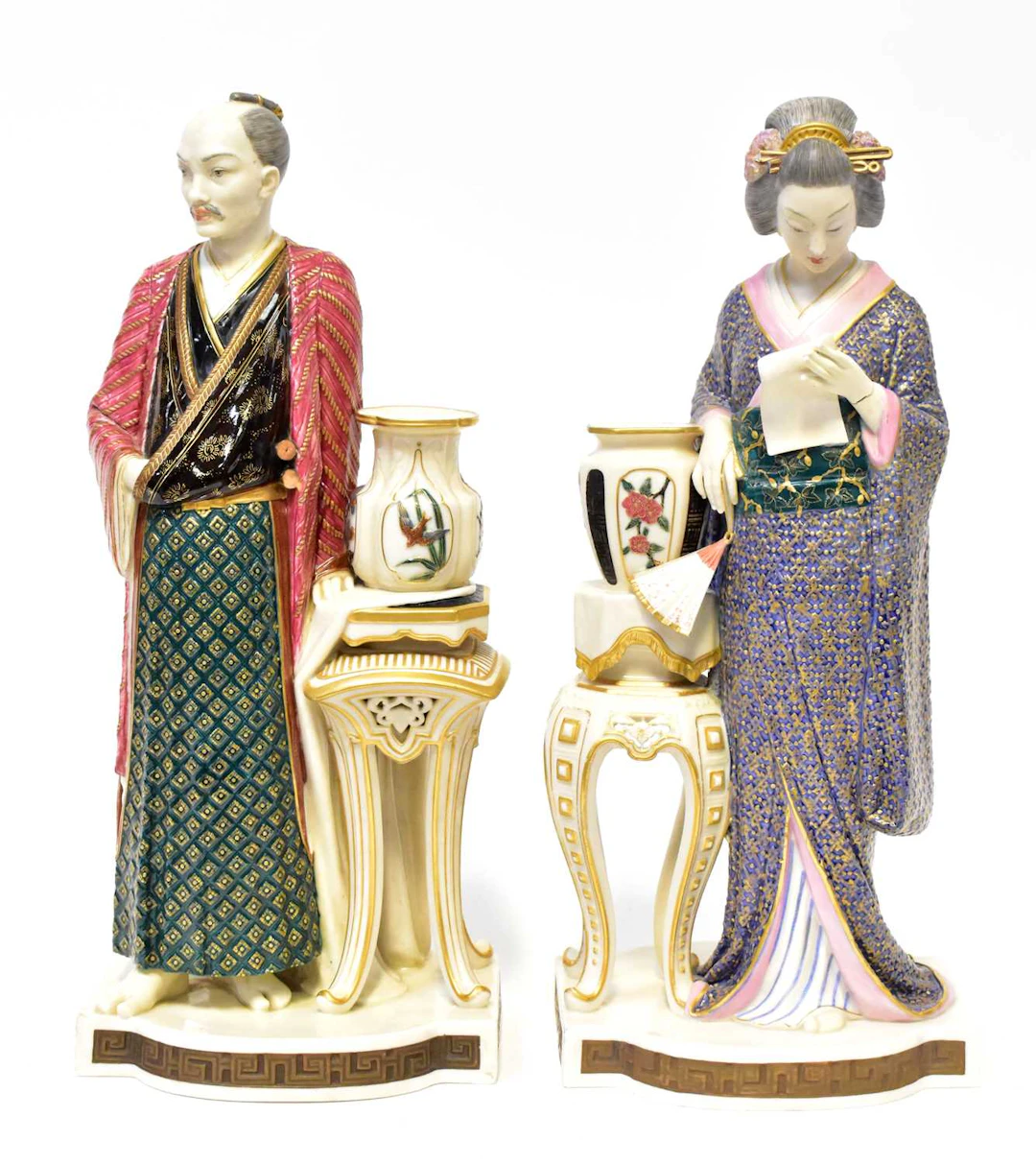 ROYAL WORCESTER; a pair of James Hadley porcelain figures...