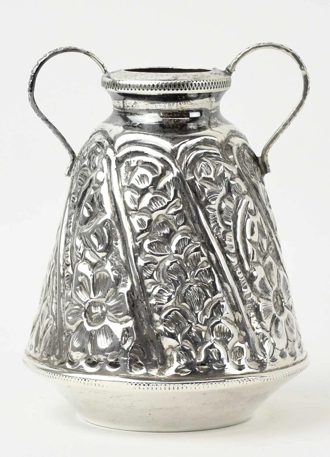 An Egyptian white metal twin handled amphora type vase