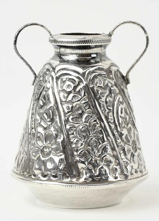 An Egyptian white metal twin handled amphora type vase