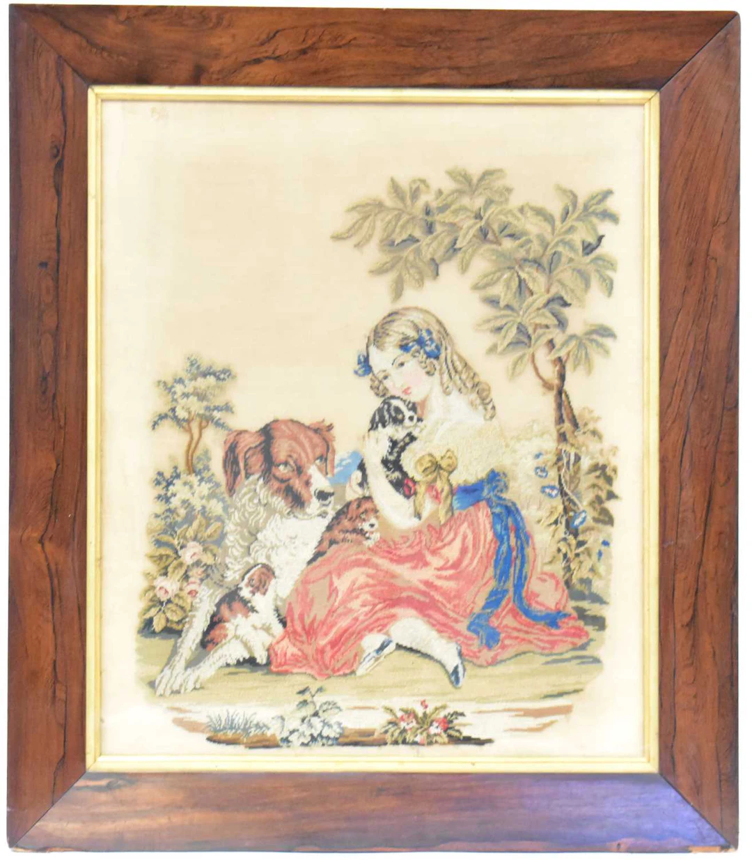 A Victorian tapestry depicting a girl cuddling puppies...