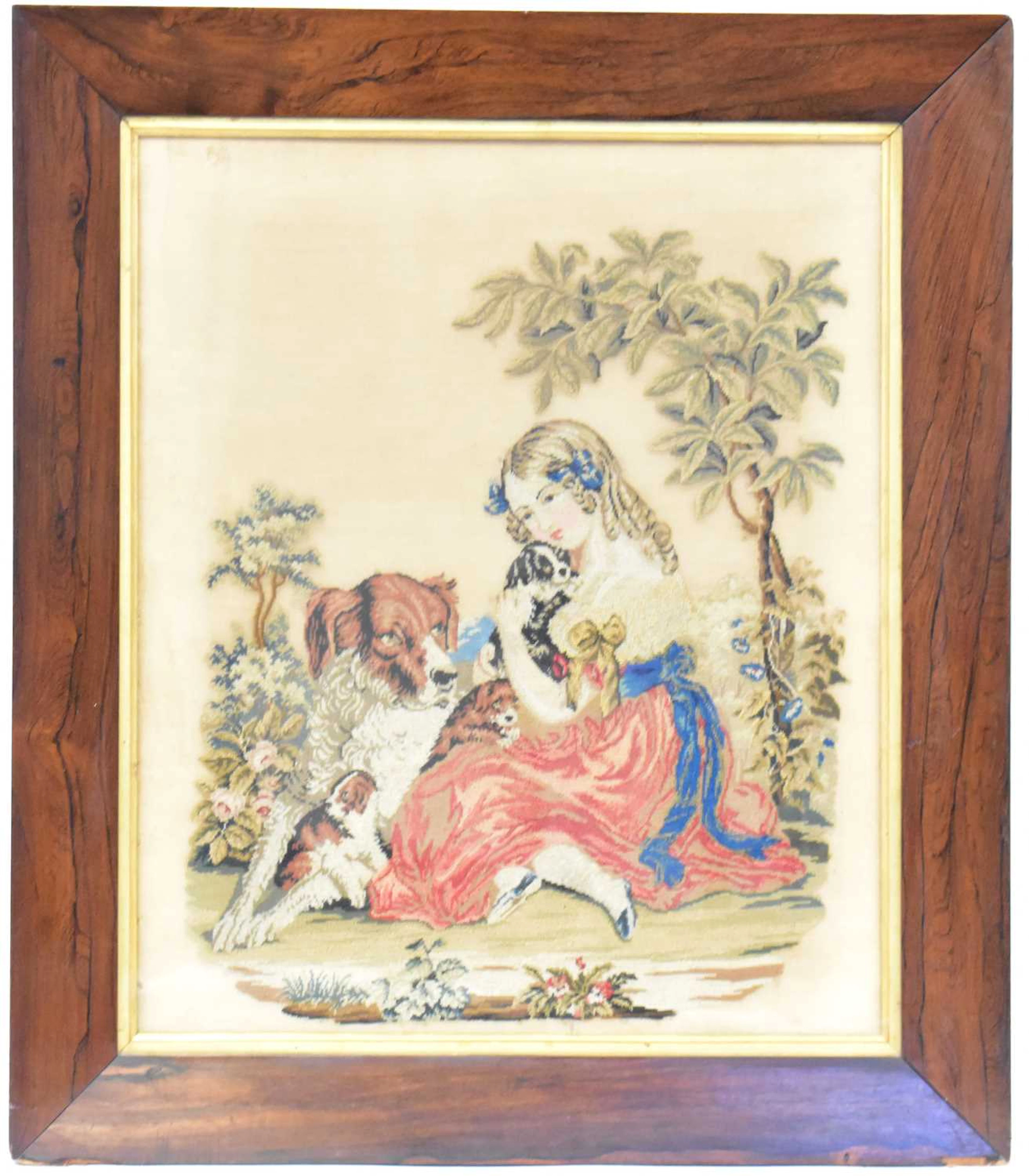 A Victorian tapestry depicting a girl cuddling puppies...