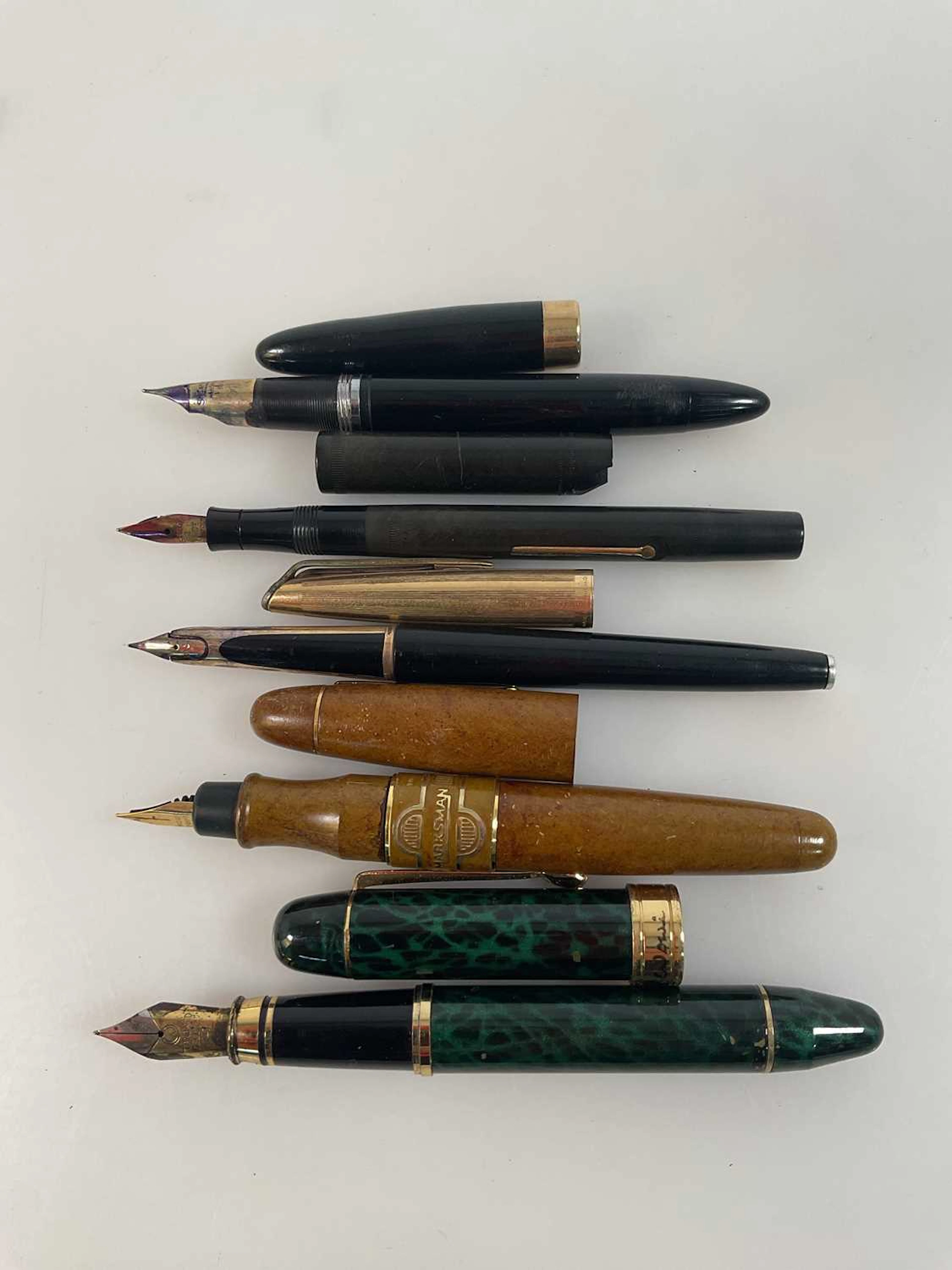 A collection of five fountain pens