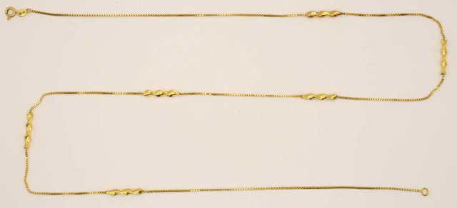 A 9ct bright yellow gold necklace consisting of six twist...
