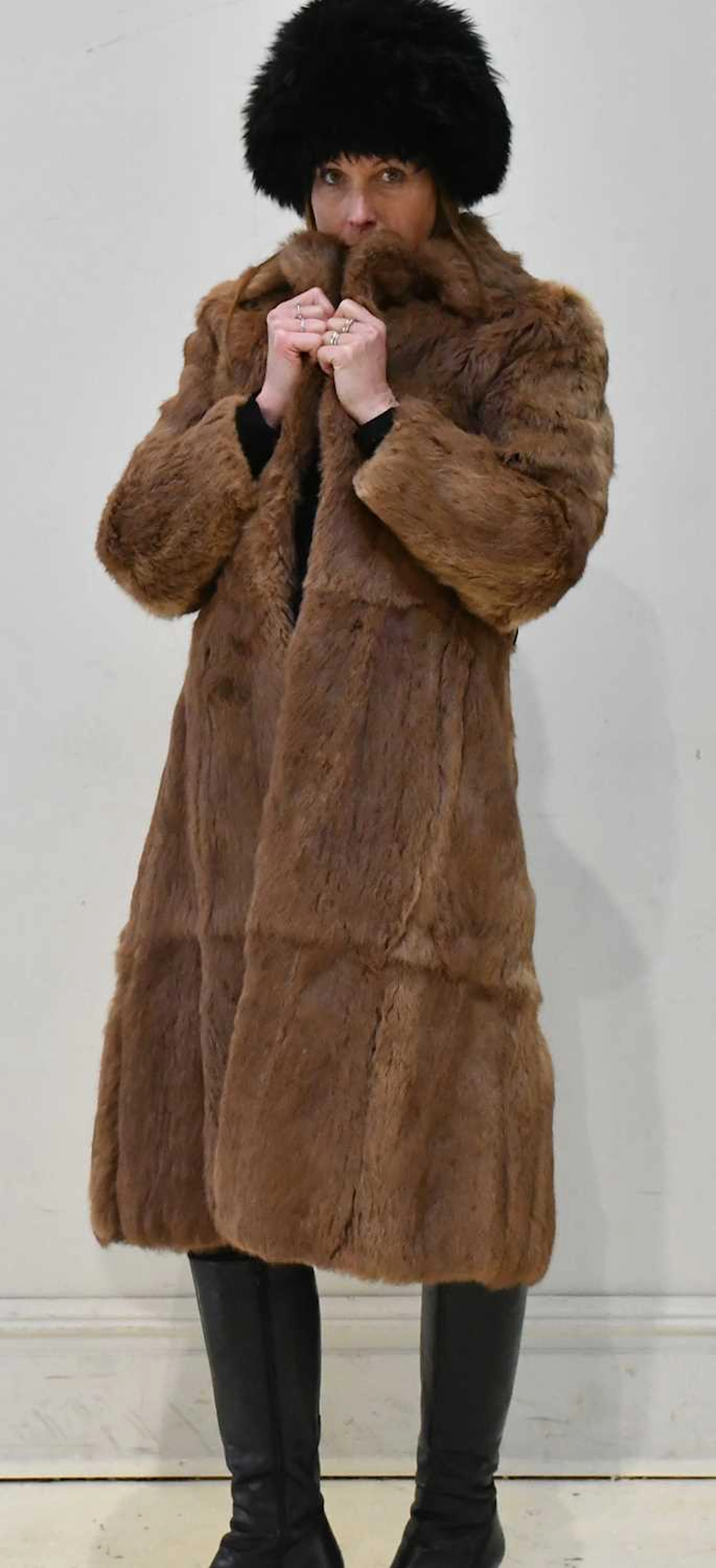 A full length light brown dyed coney fur coat