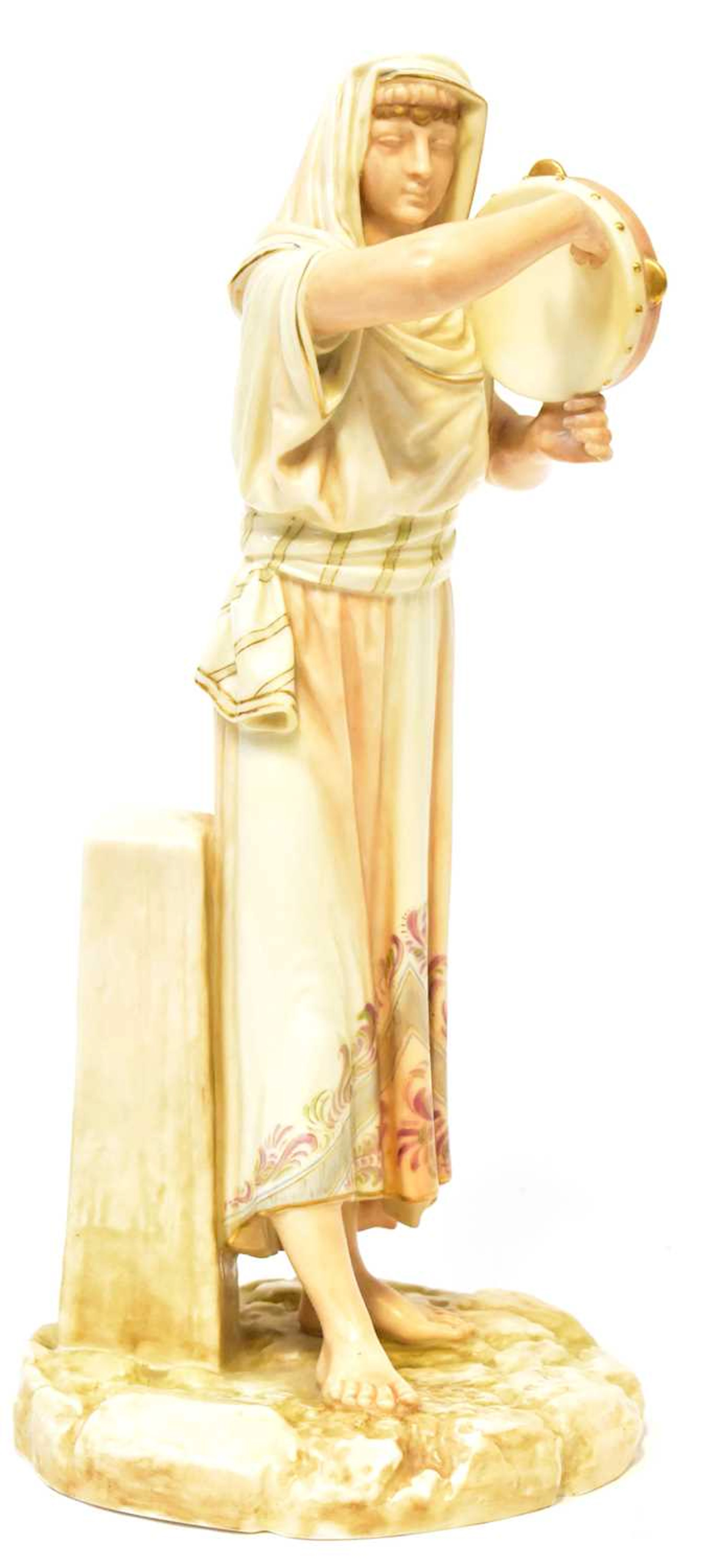 ROYAL WORCESTER; a James Hadley porcelain figure of an...