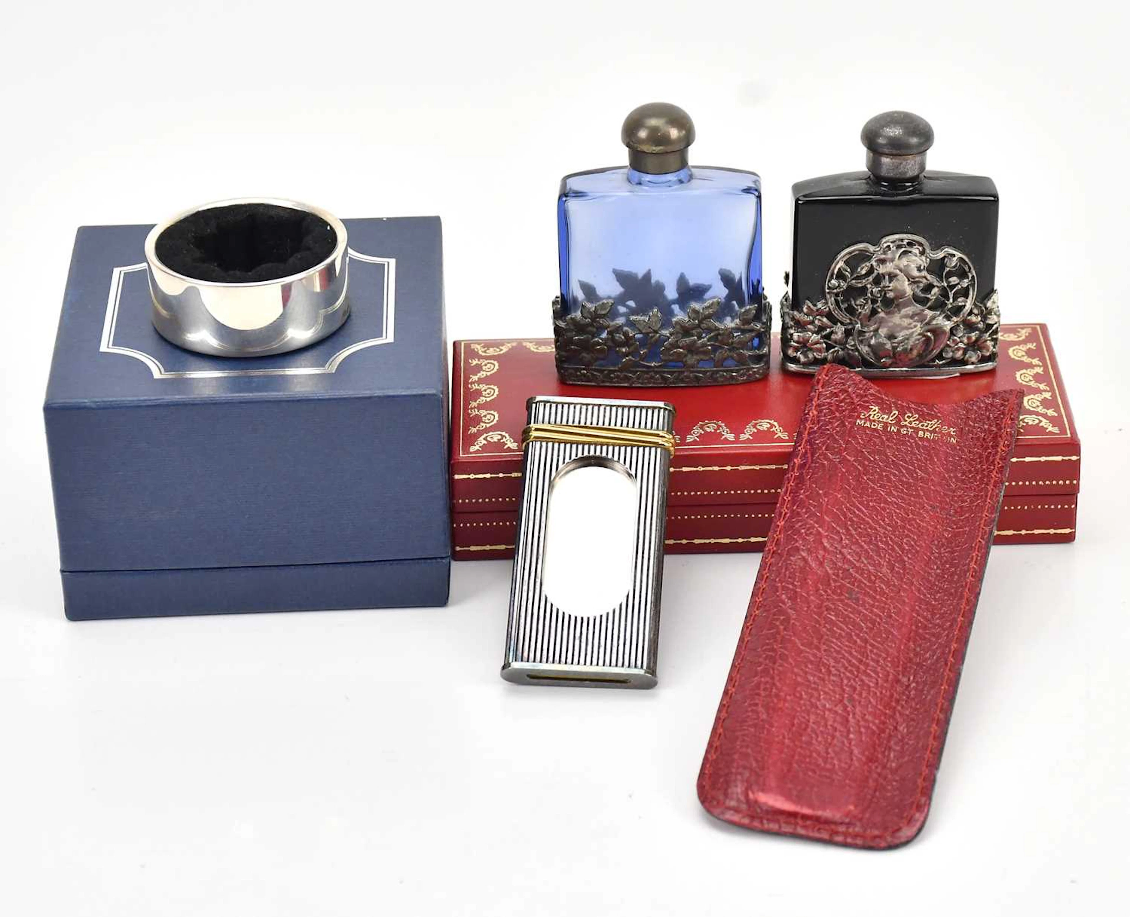 MUST DE CARTIER; a white metal fluted cigar cutter