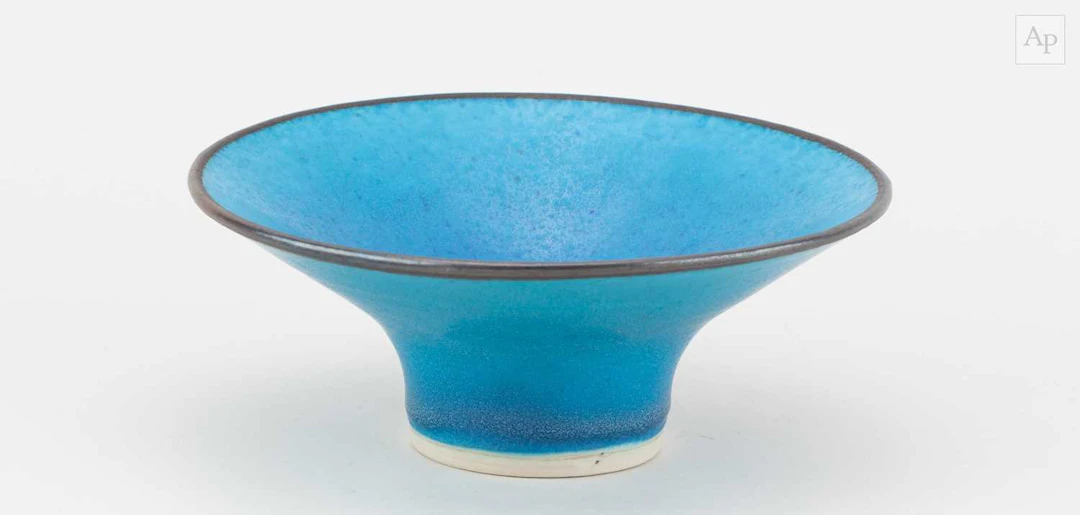 ABDO NAGI (1941-2001); a porcelain dish covered in bright...