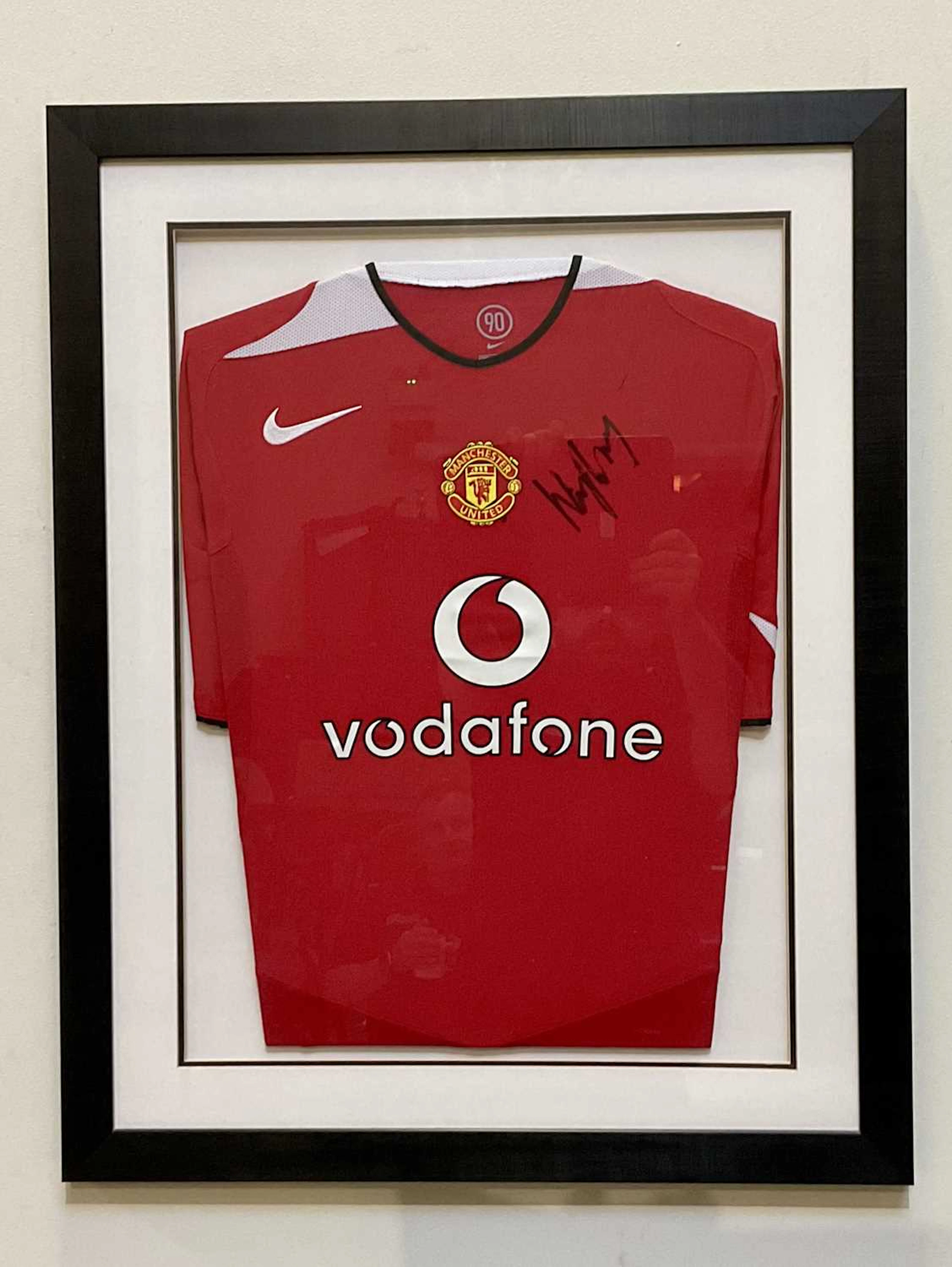 WAYNE ROONEY; an autographed Manchester United shirt