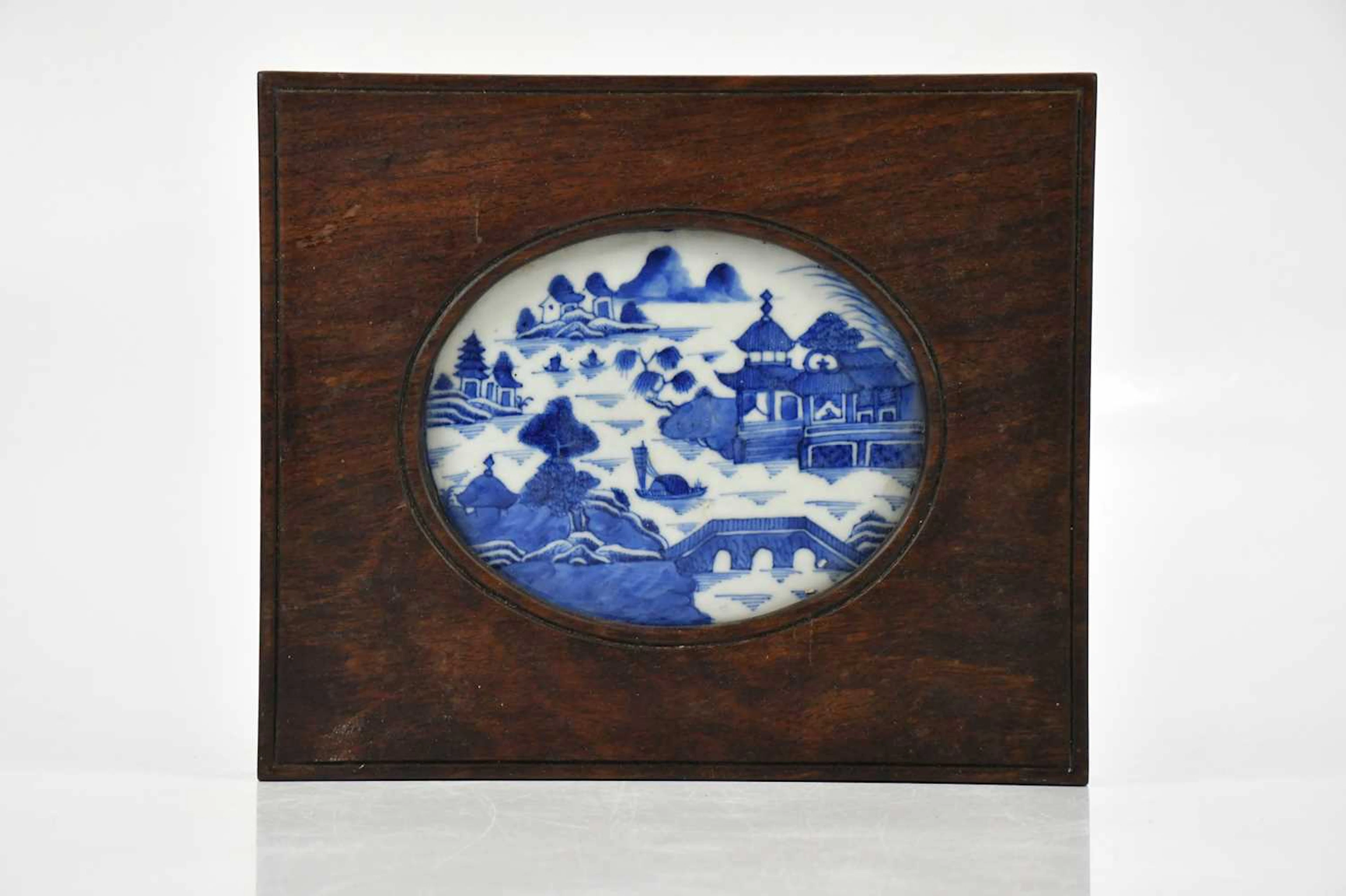A Chinese porcelain blue and white oval panel