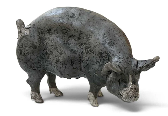 CHRISTINE CUMMINGS; a studio pottery partially raku glazed figure of a pig