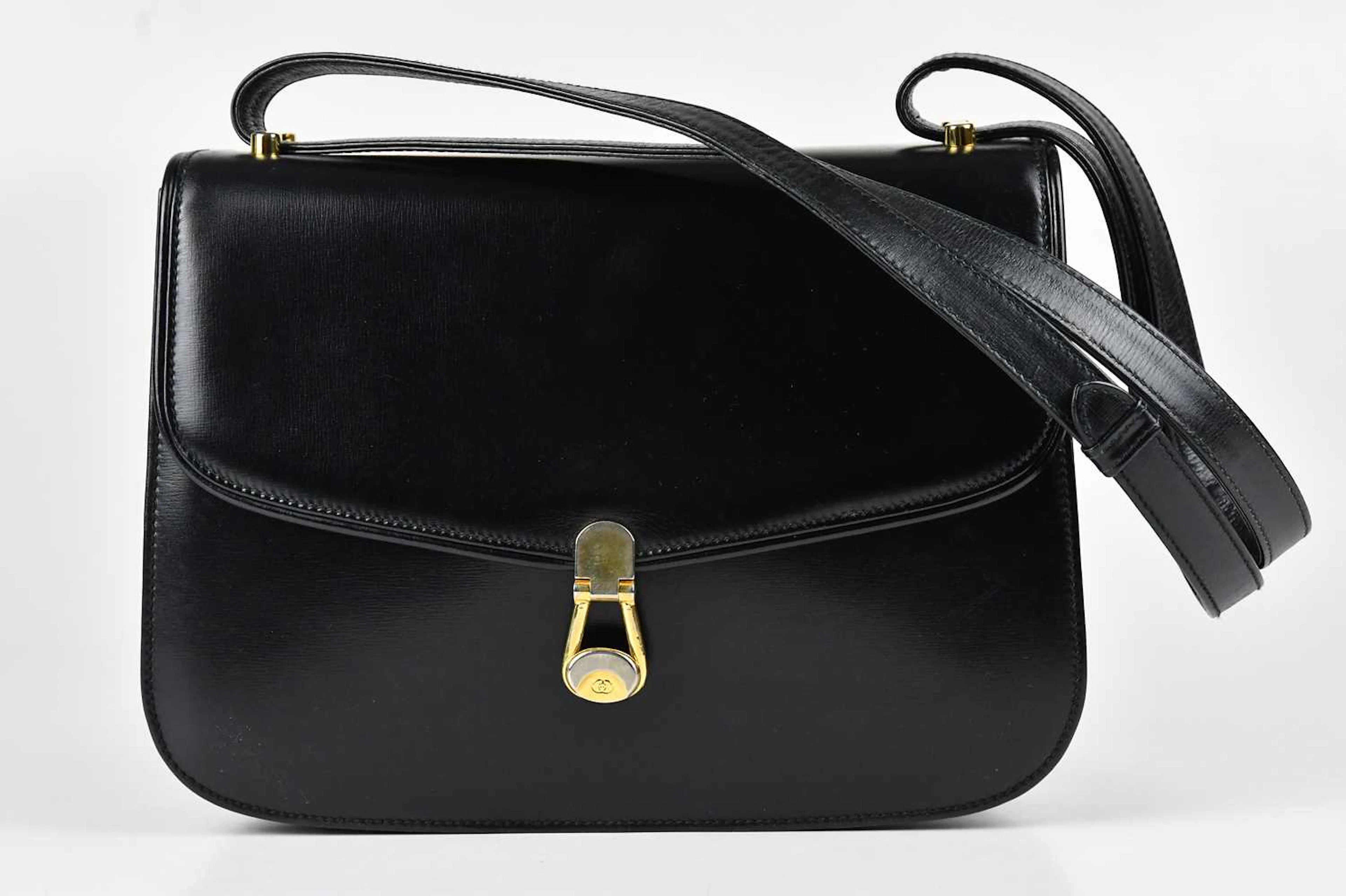 GUCCI; a vintage old Gucci calfskin black leather handbag