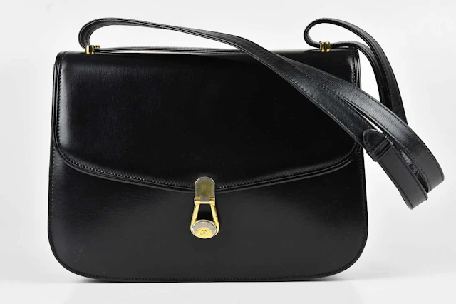 GUCCI; a vintage old Gucci calfskin black leather handbag