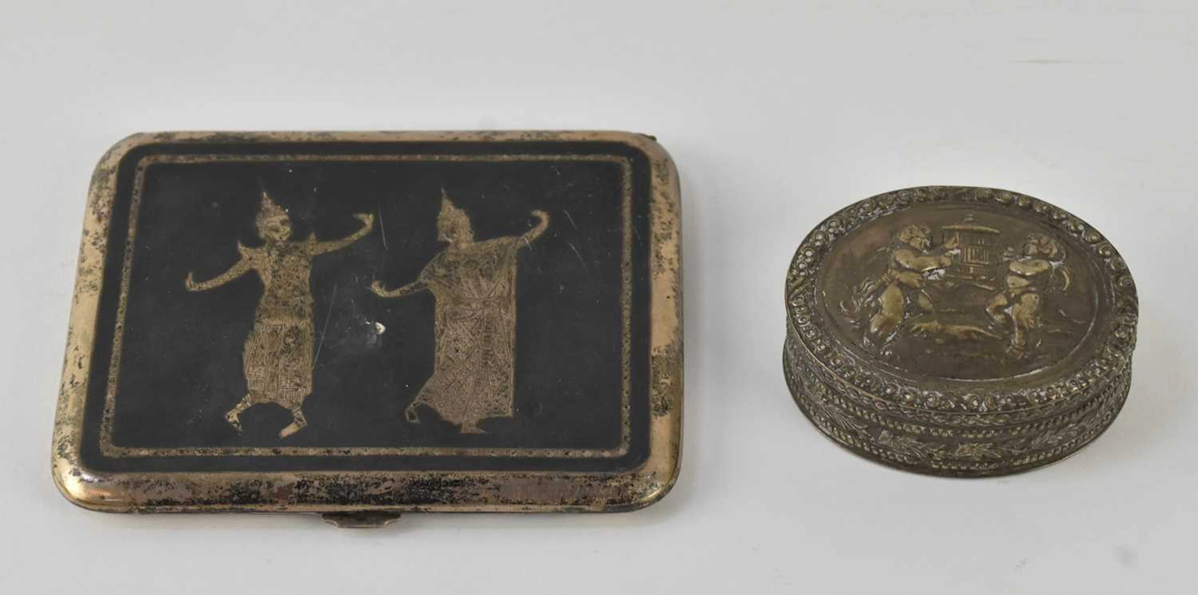 An early 20th century Thai white metal niello work cigarette case