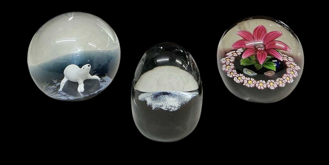 CAITHNESS; three assorted millefiori glass limited edition paperweights
