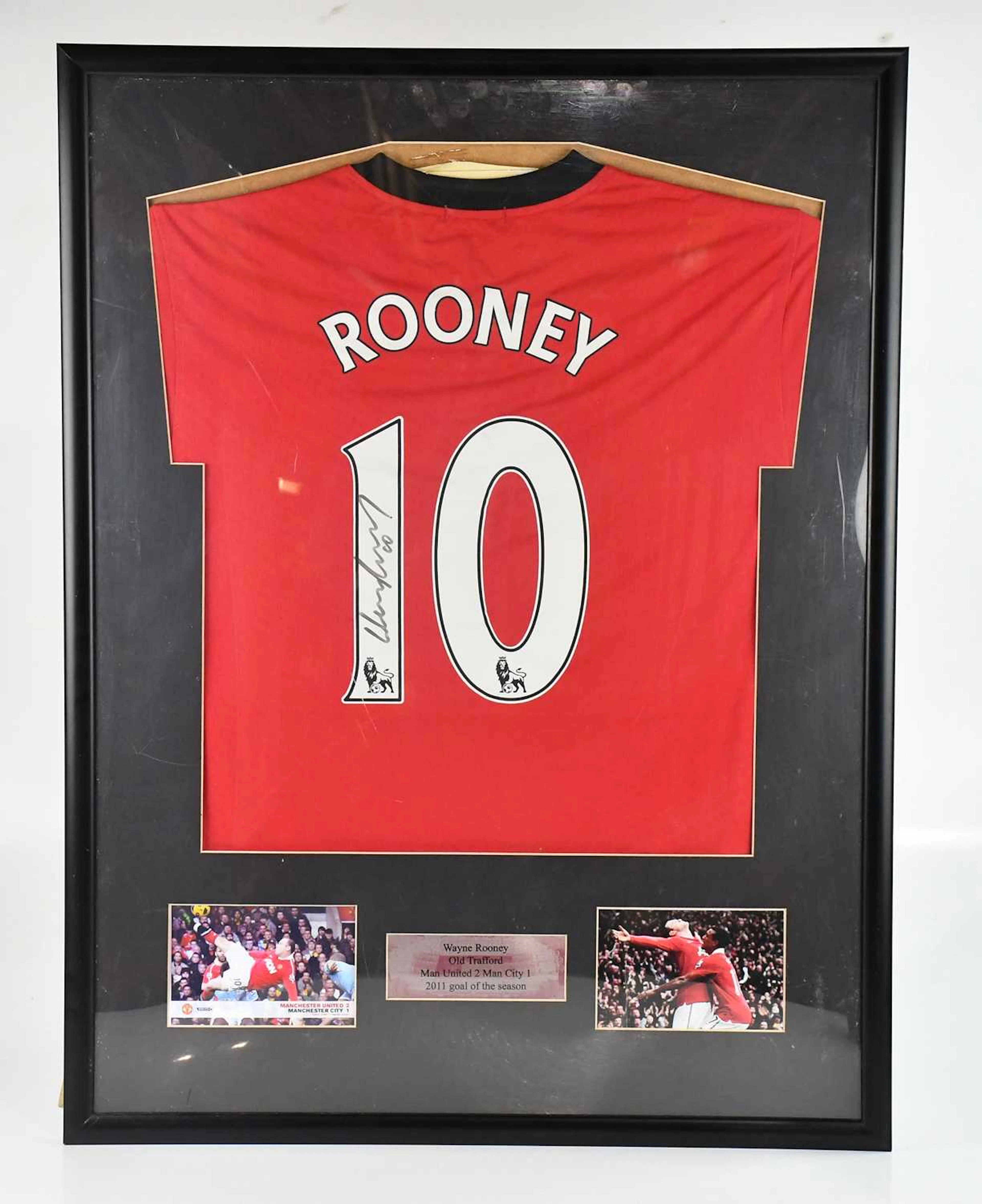 WAYNE ROONEY; an autographed replica Manchester United jersey
