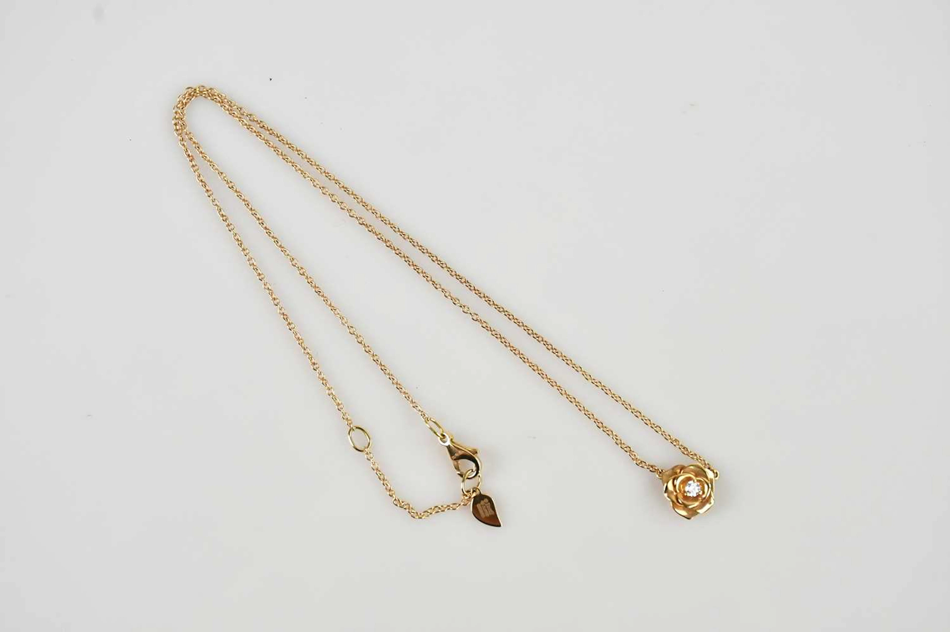 PIAGET; a yellow metal floral diamond set necklace