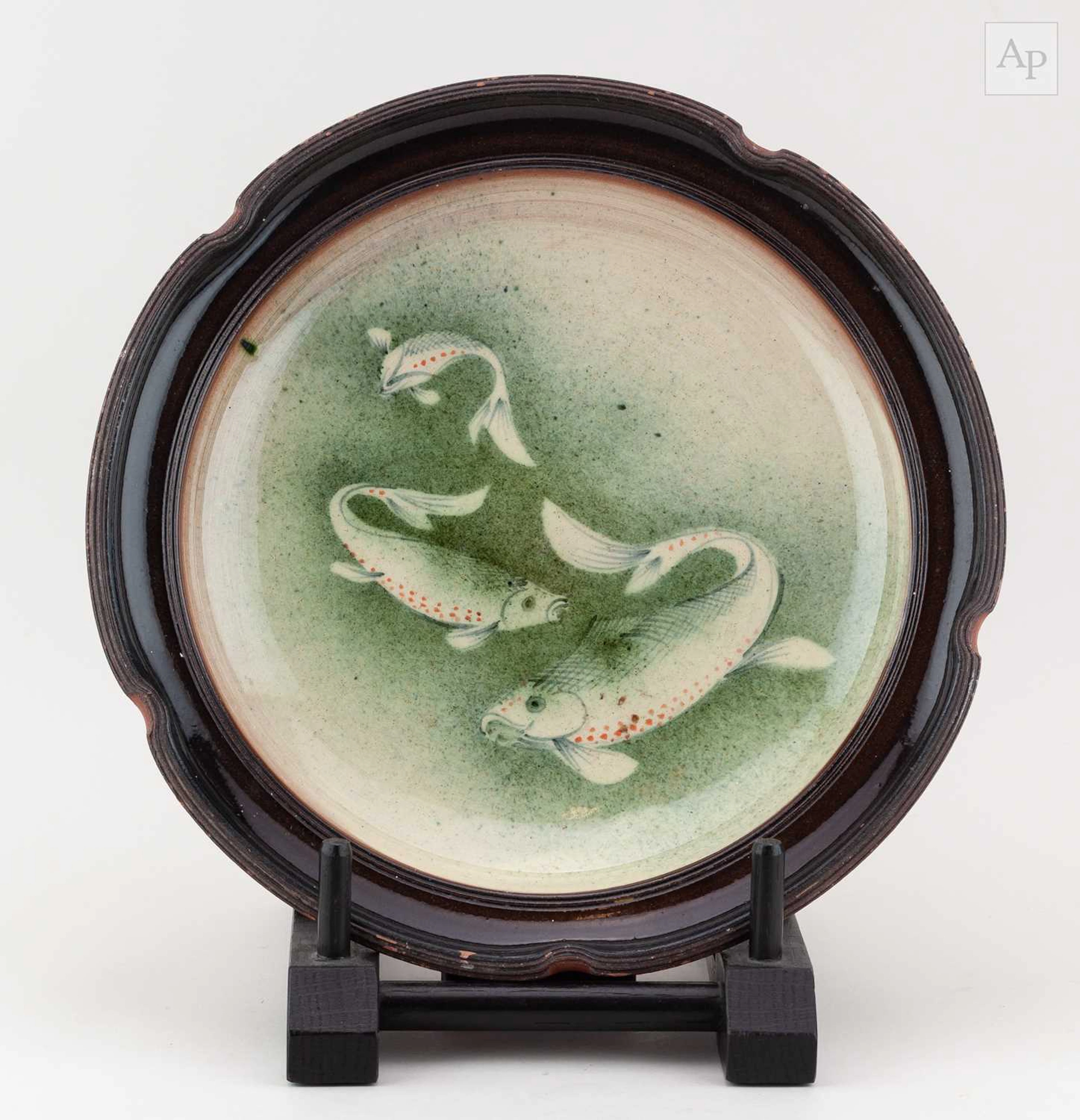 JOE FINCH (born 1947); a large slipware dish decorated with fish