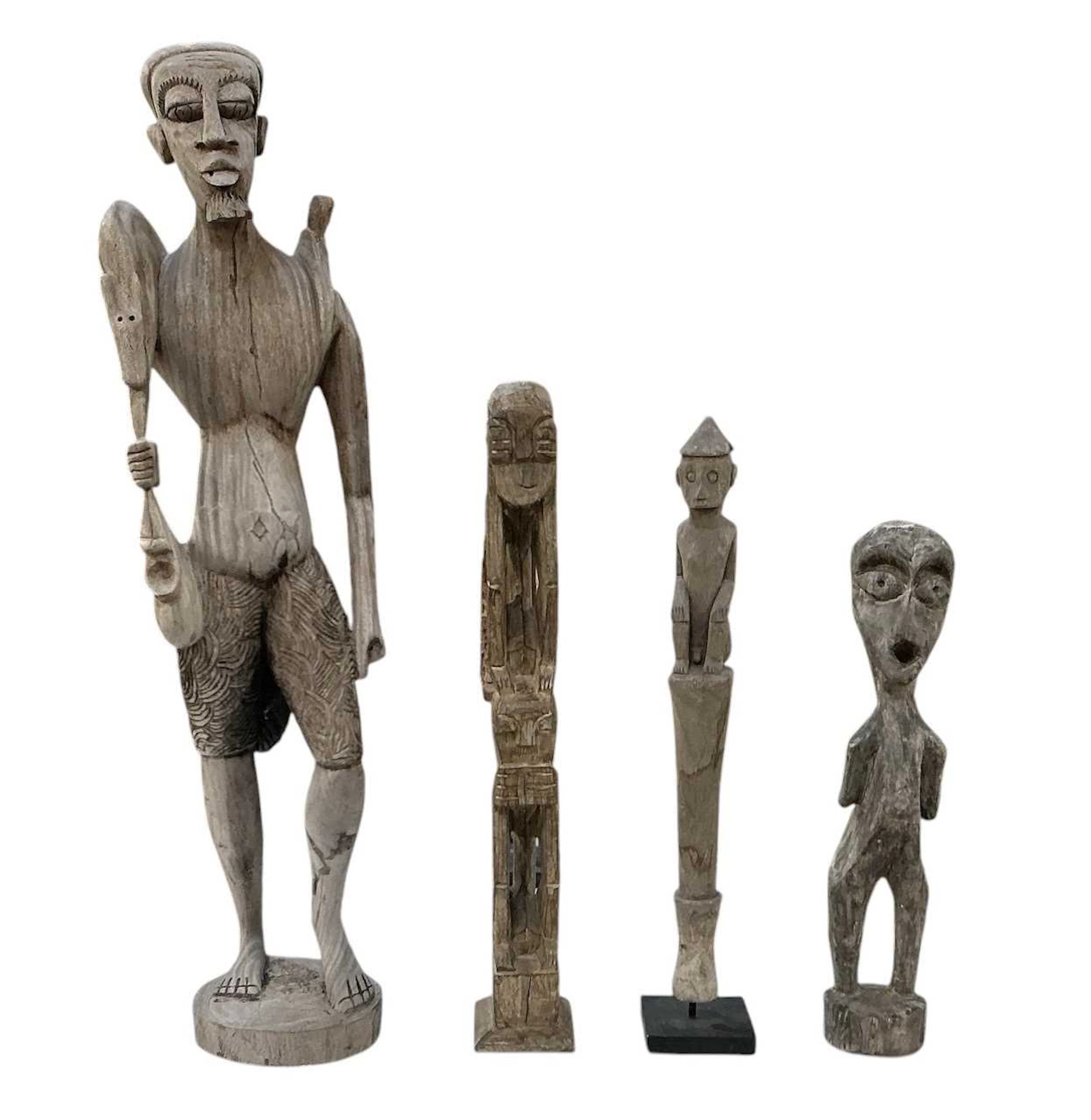 A large modern African carved wooden tribal figure of a standing gentleman