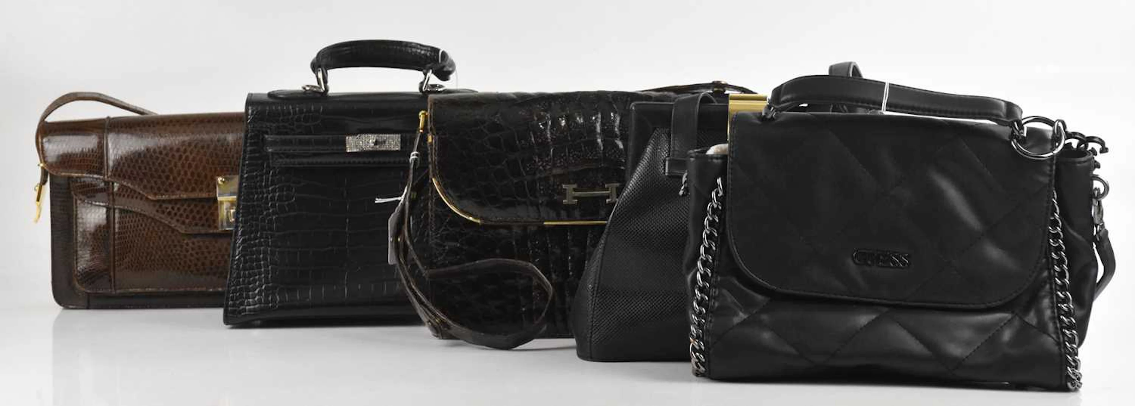 GUESS; a black quilted leather handbag with detachable shoulder strap