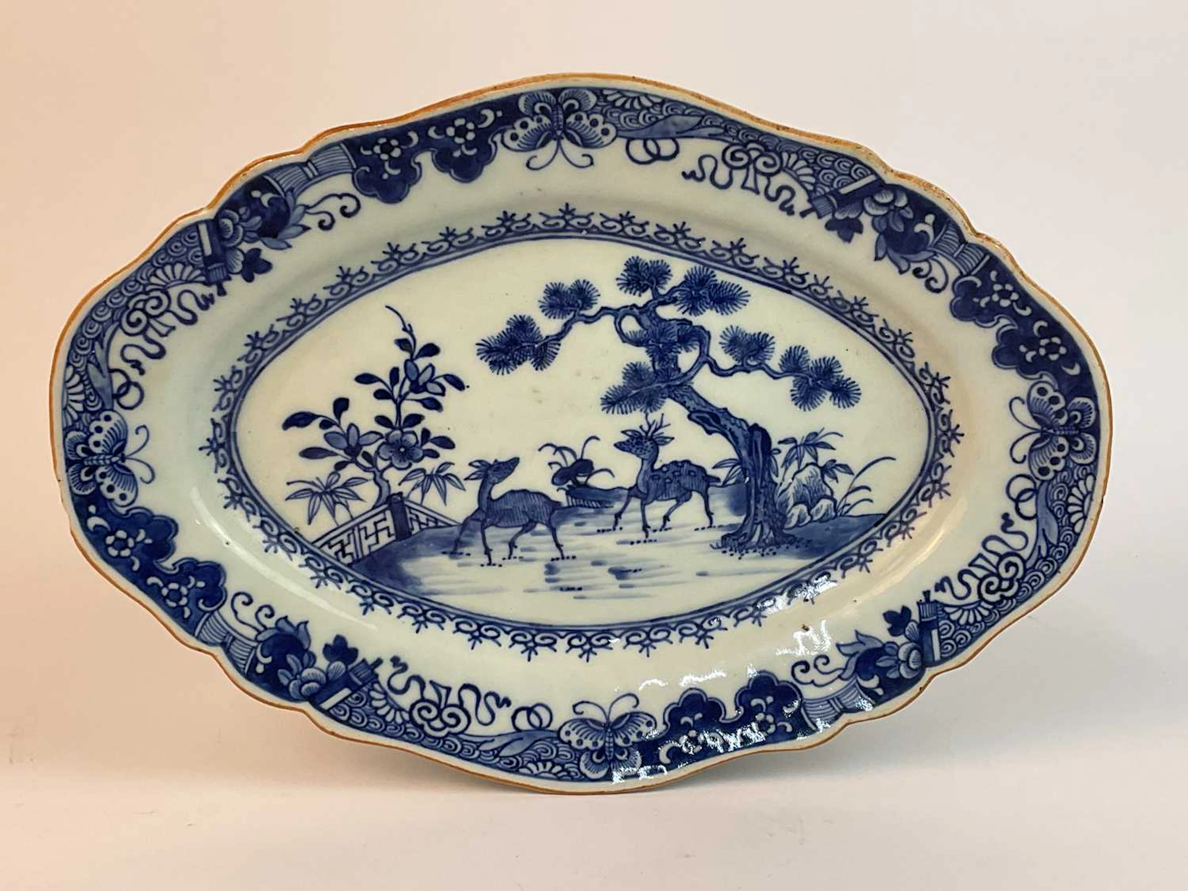A Chinese scallop shaped dish decorated with a central...