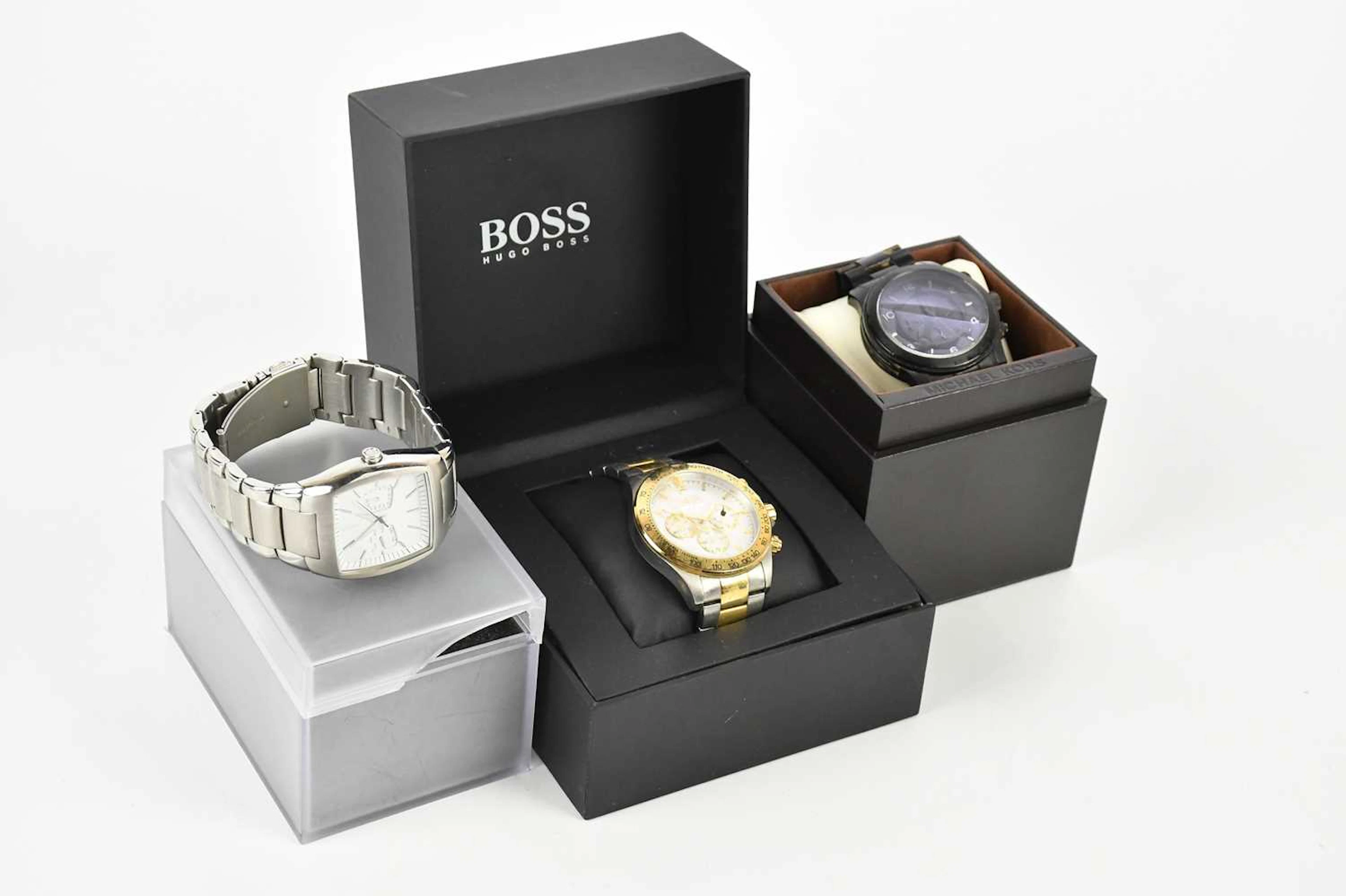 Three decorative dress watches comprising Michael Kors