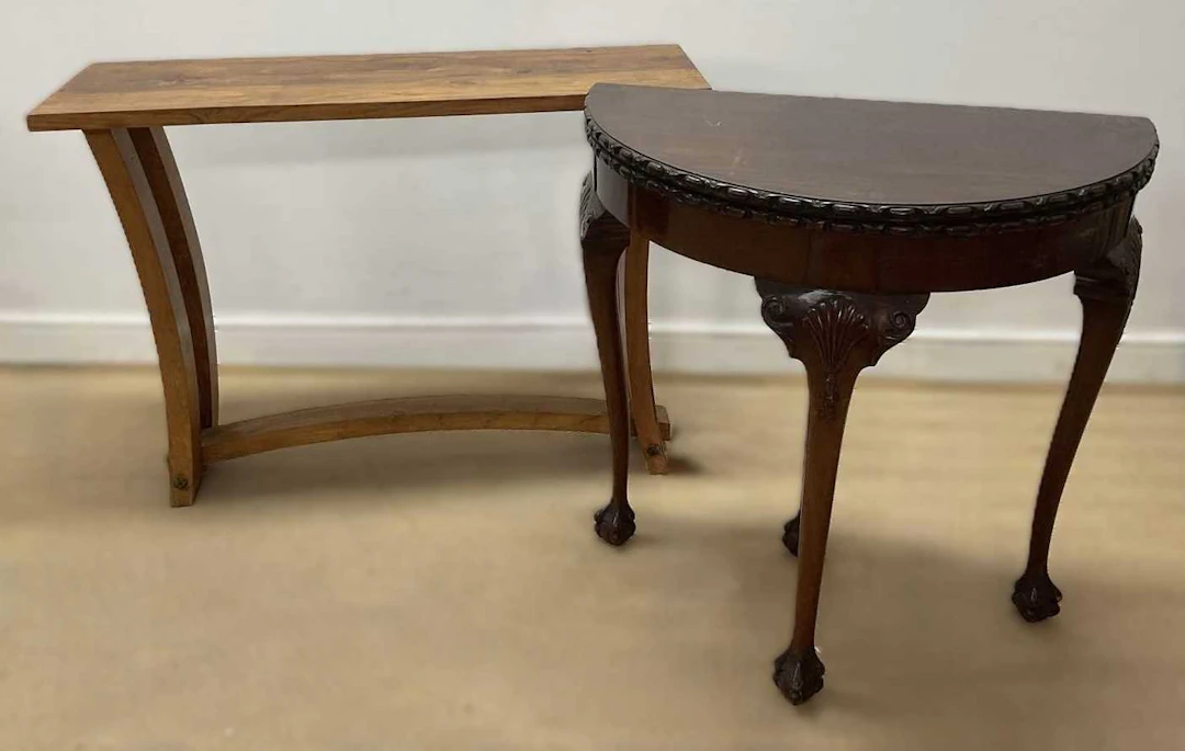 A modern knotted pine hall table with arched support