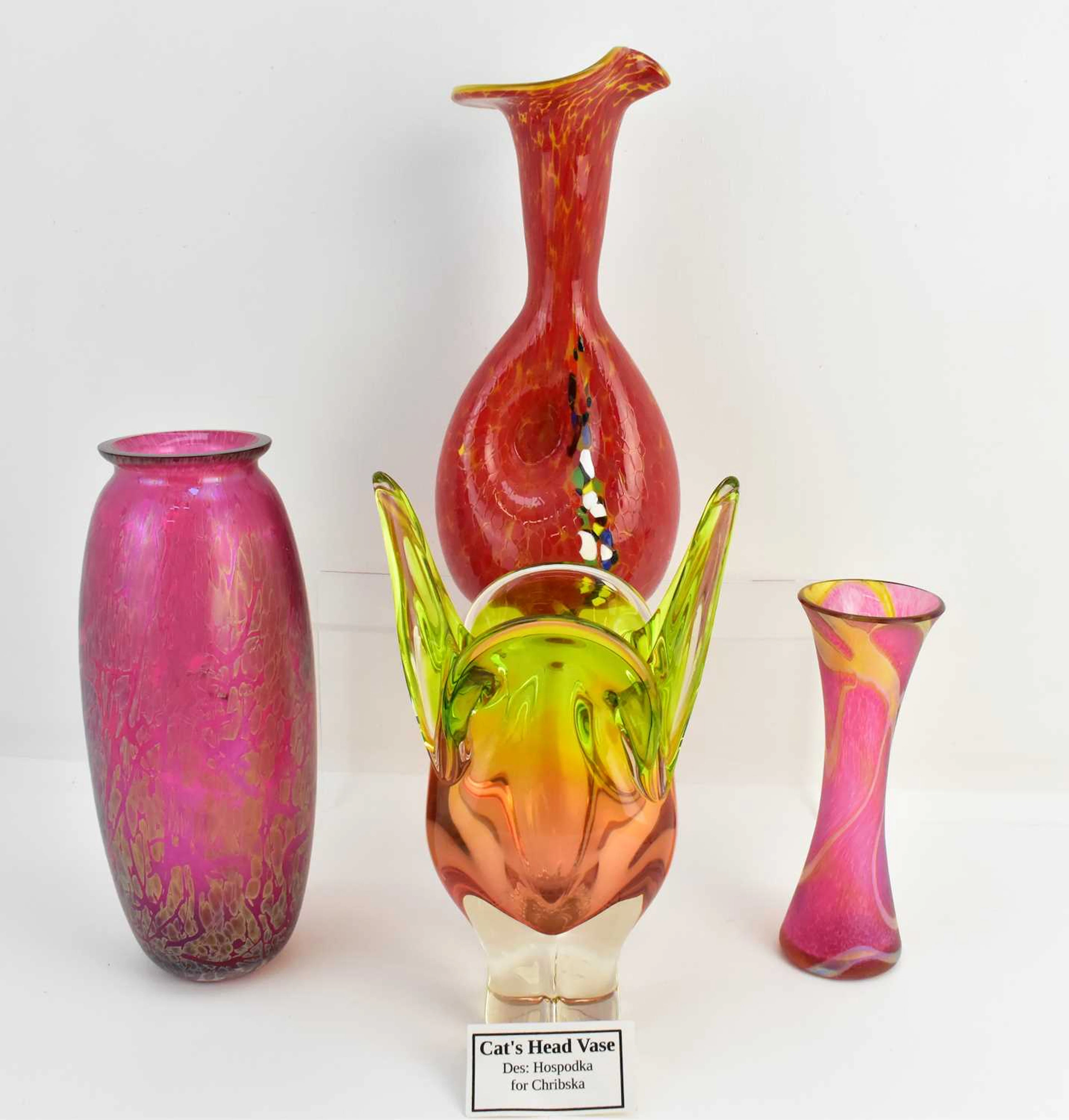 Four items of coloured art glass