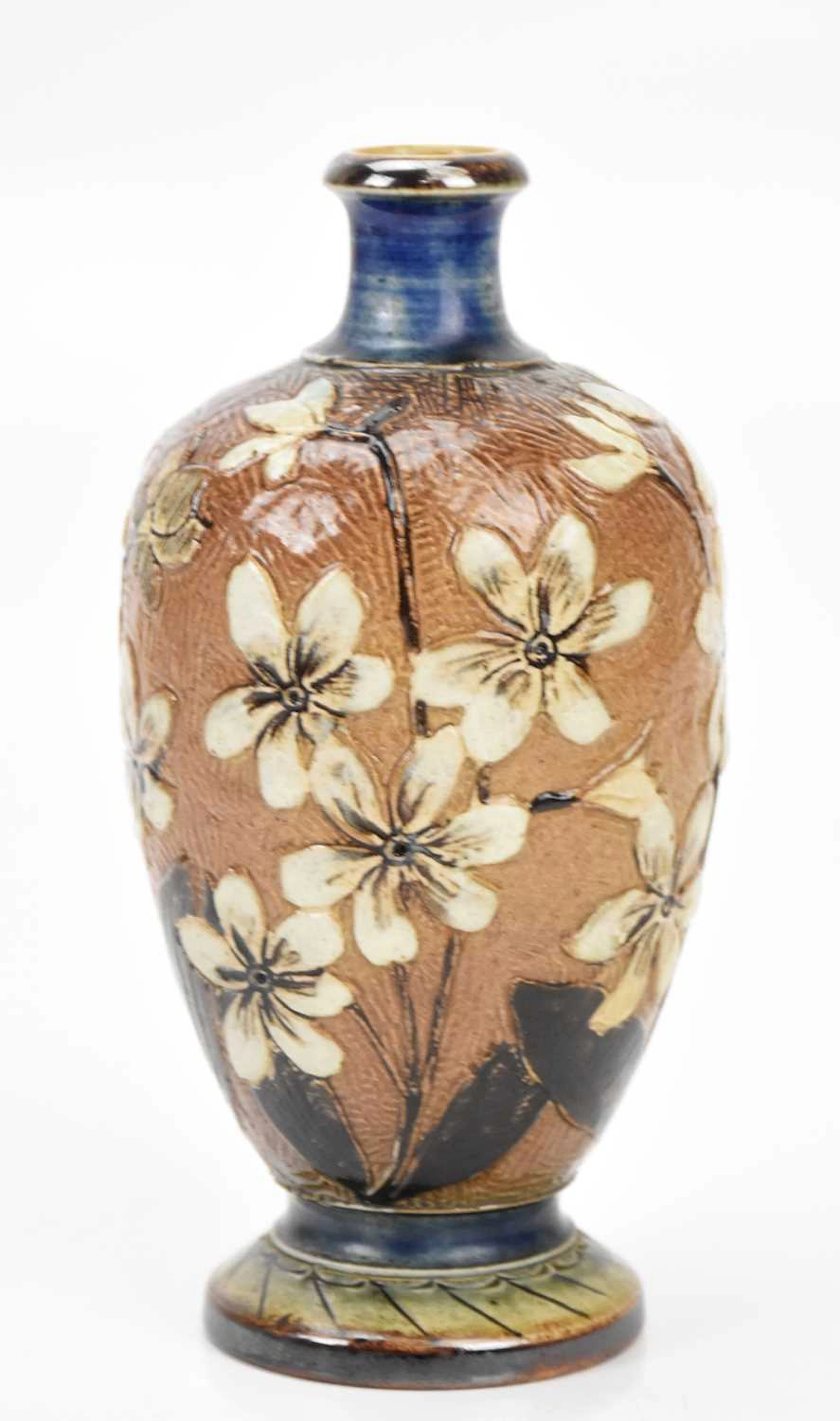 ROBERT WALLACE MARTIN; a stoneware bottle vase with floral sprays