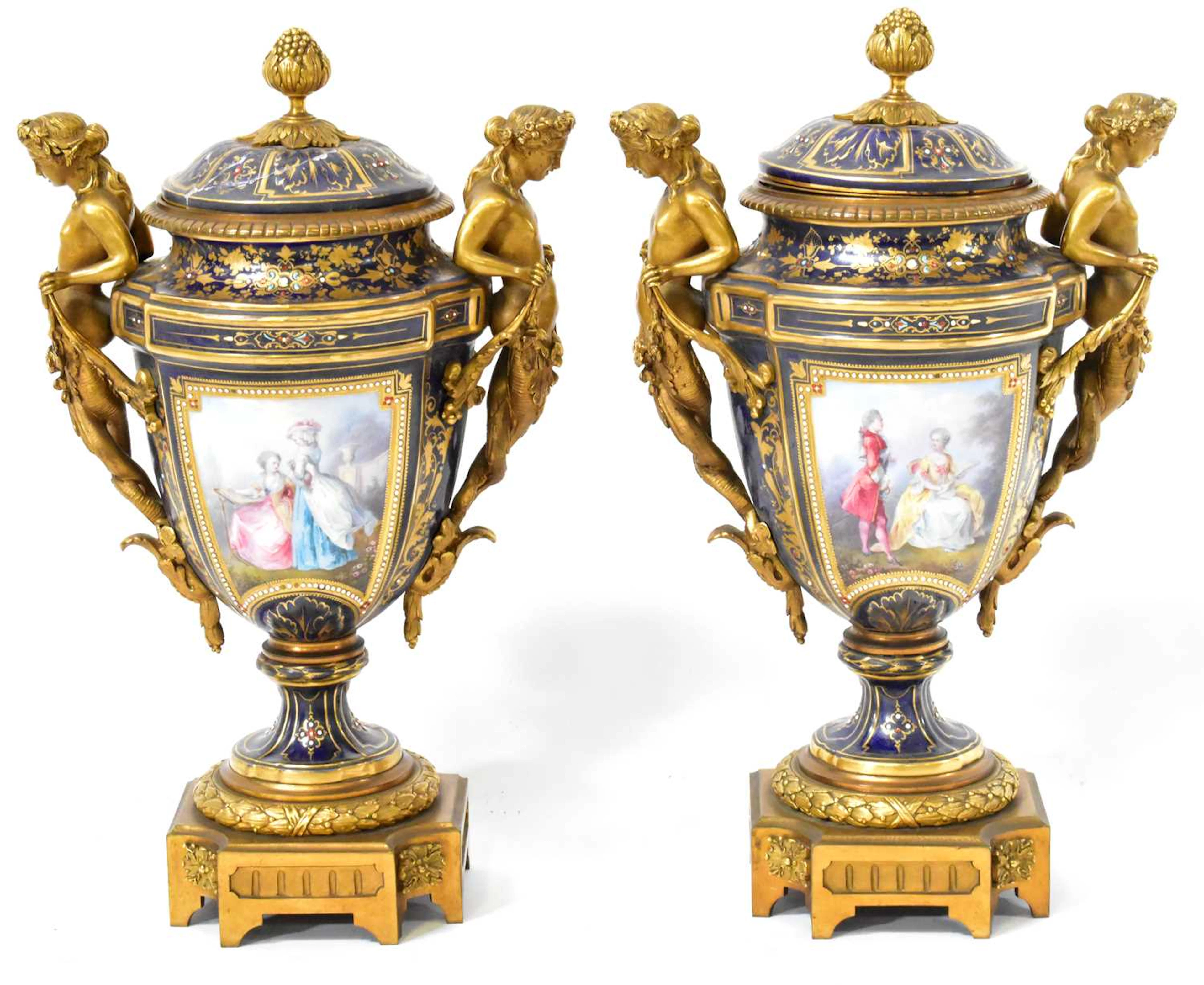 A pair of 19th century Sevres style gilt bronze vases and covers