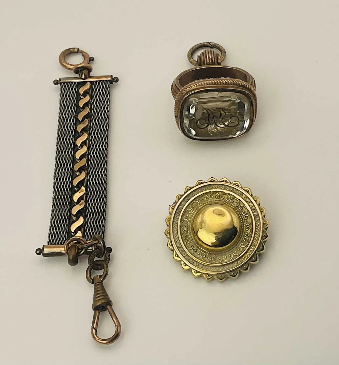 A Victorian rolled gold pocket watch chain and fob and rock crystal intaglio