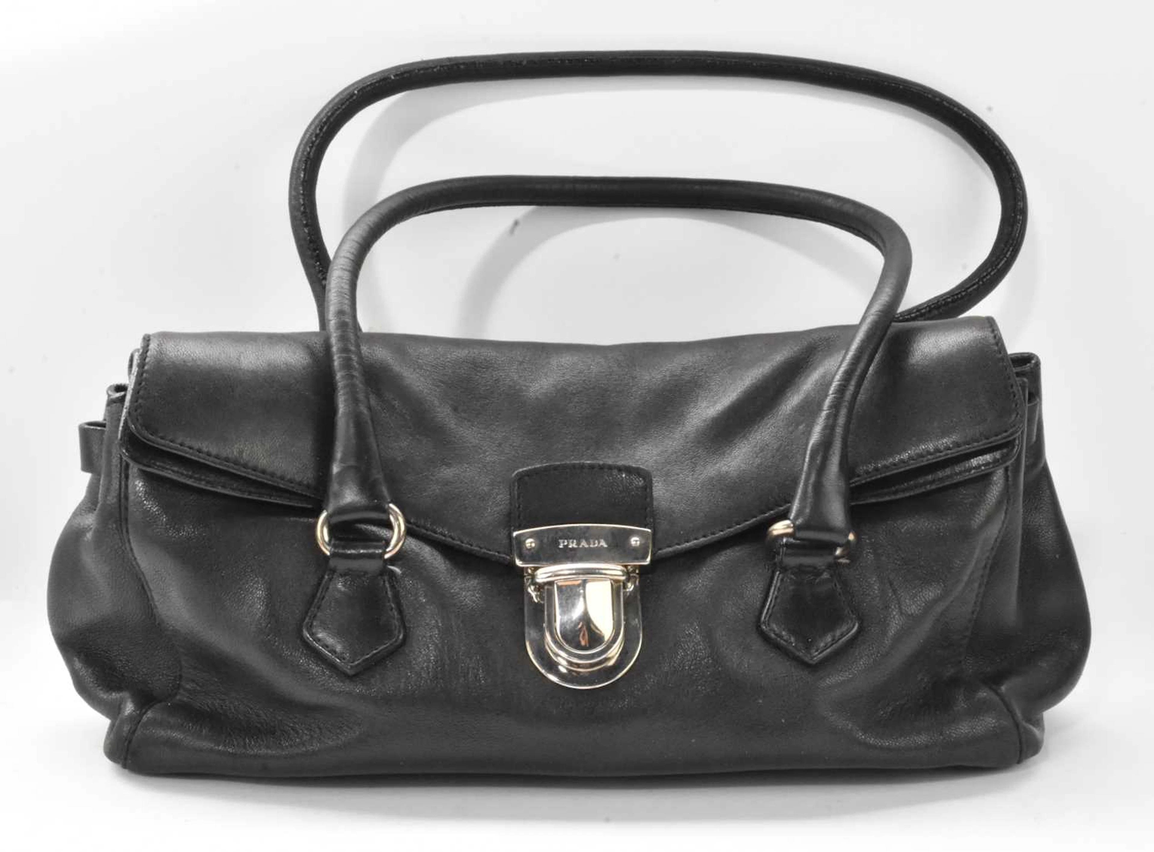 PRADA; a vintage black leather lady's handbag