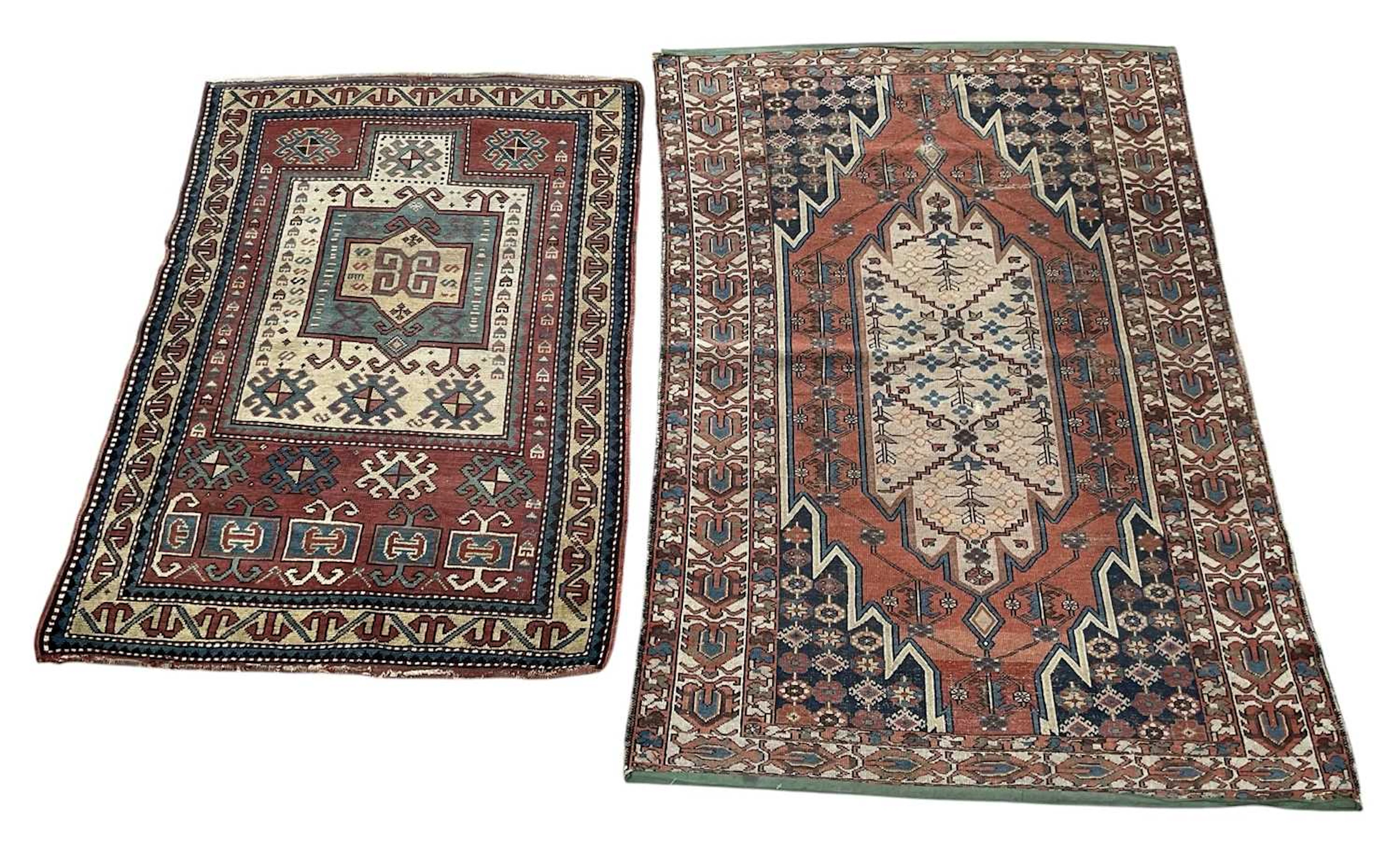 Two vintage hand woven Persian style red ground carpets