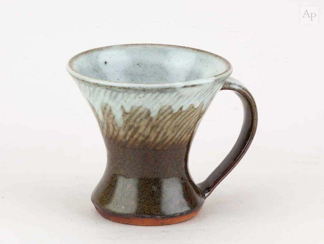 TATSUZO SHIMAOKA (1919-2007); a stoneware mug partially...