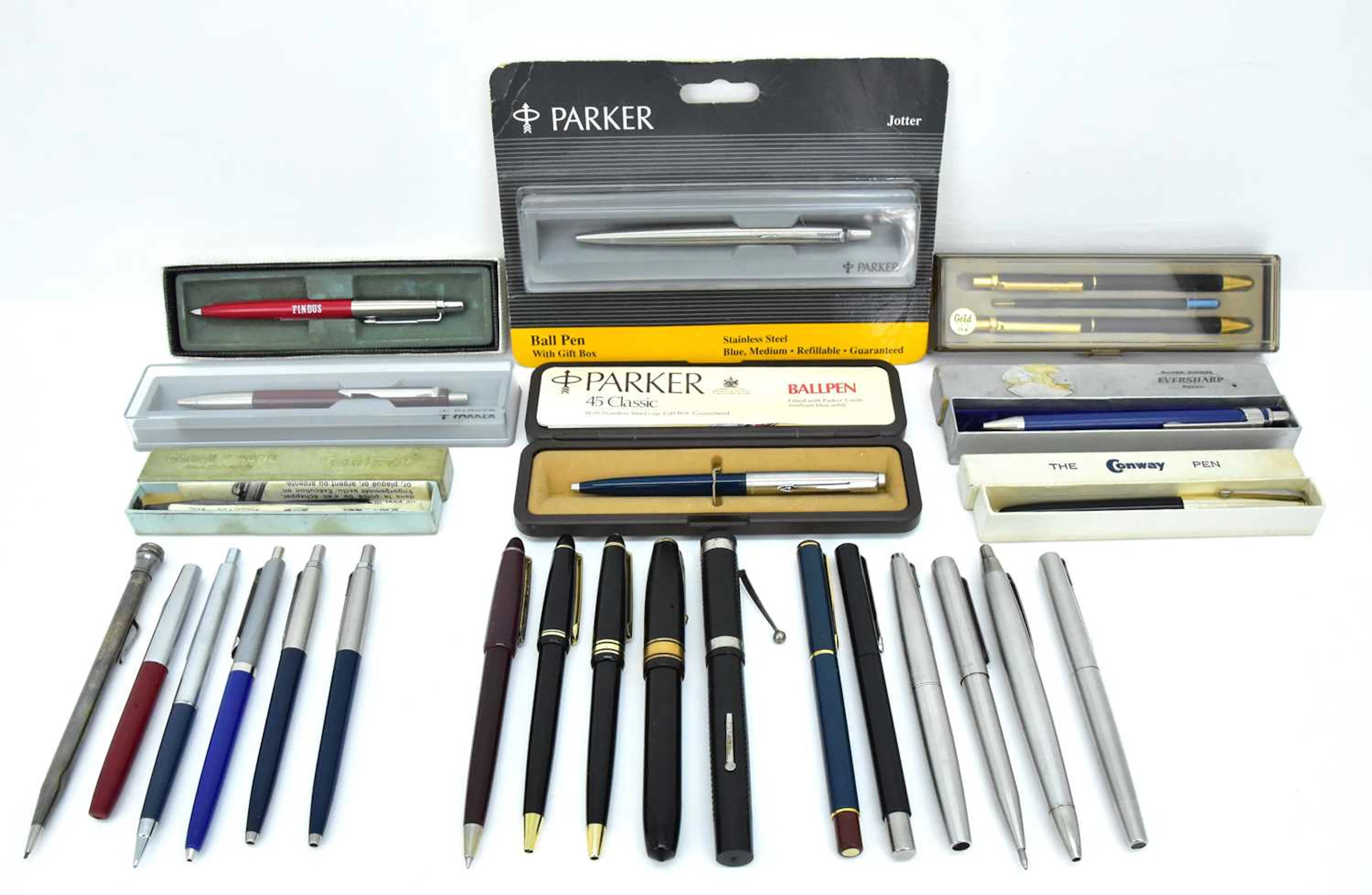 A collection of vintage fountain and ballpoint pens