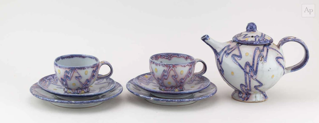 Dartington Pottery; a stoneware teapot and a pair of tea...