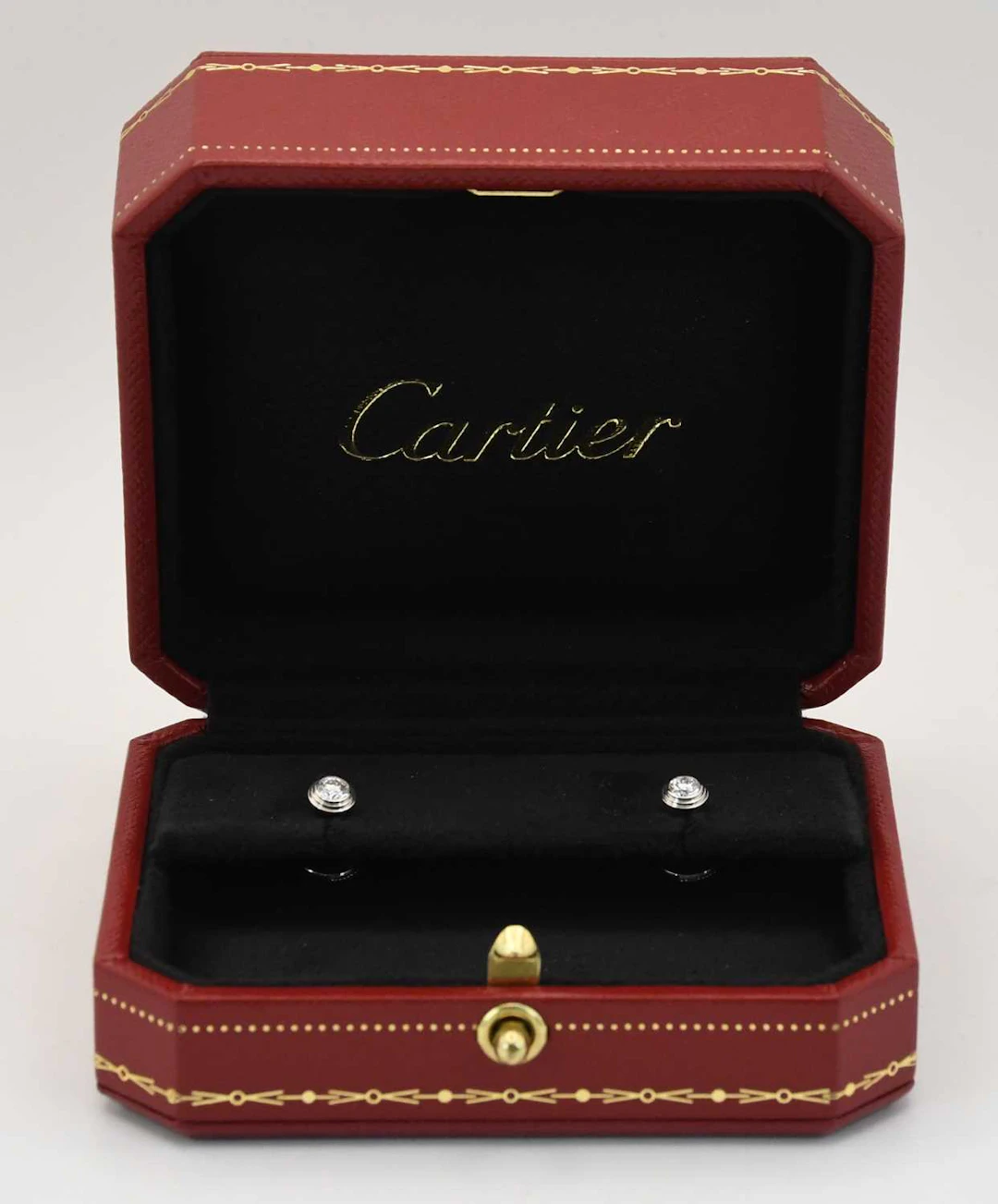 CARTIER; a pair of 18ct white gold diamond set ear studs