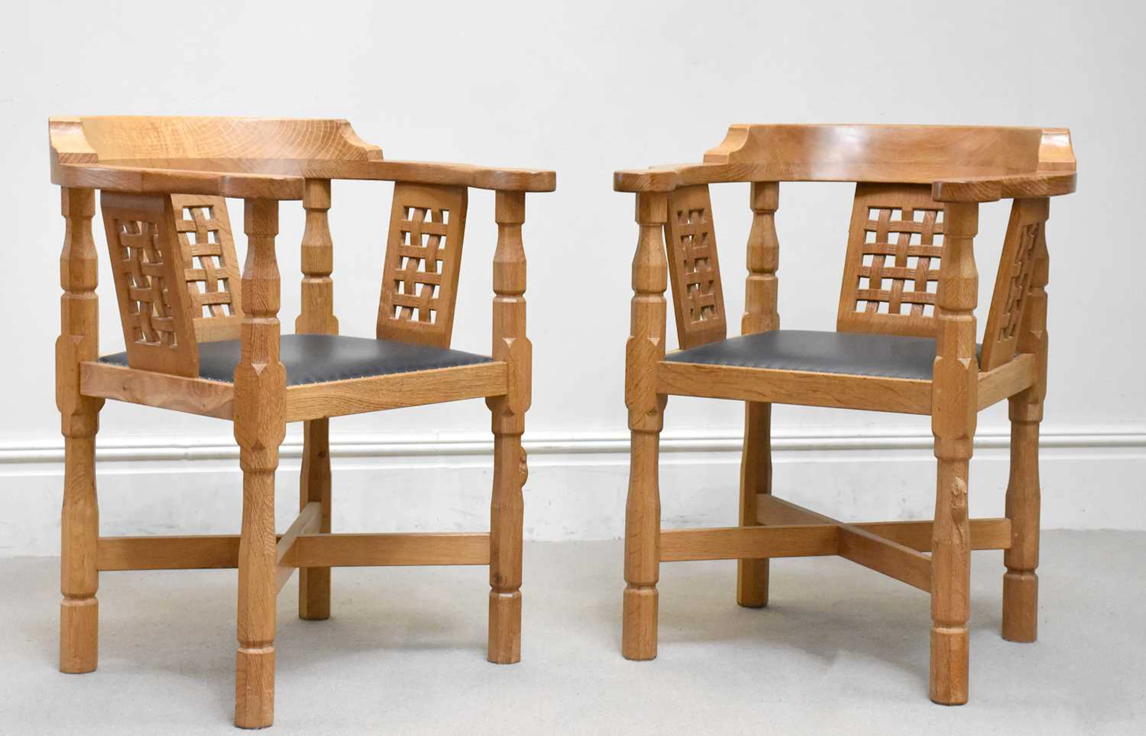 ROBERT ‘MOUSEMAN’ THOMPSON; a pair of carved oak ‘Monk’ chairs