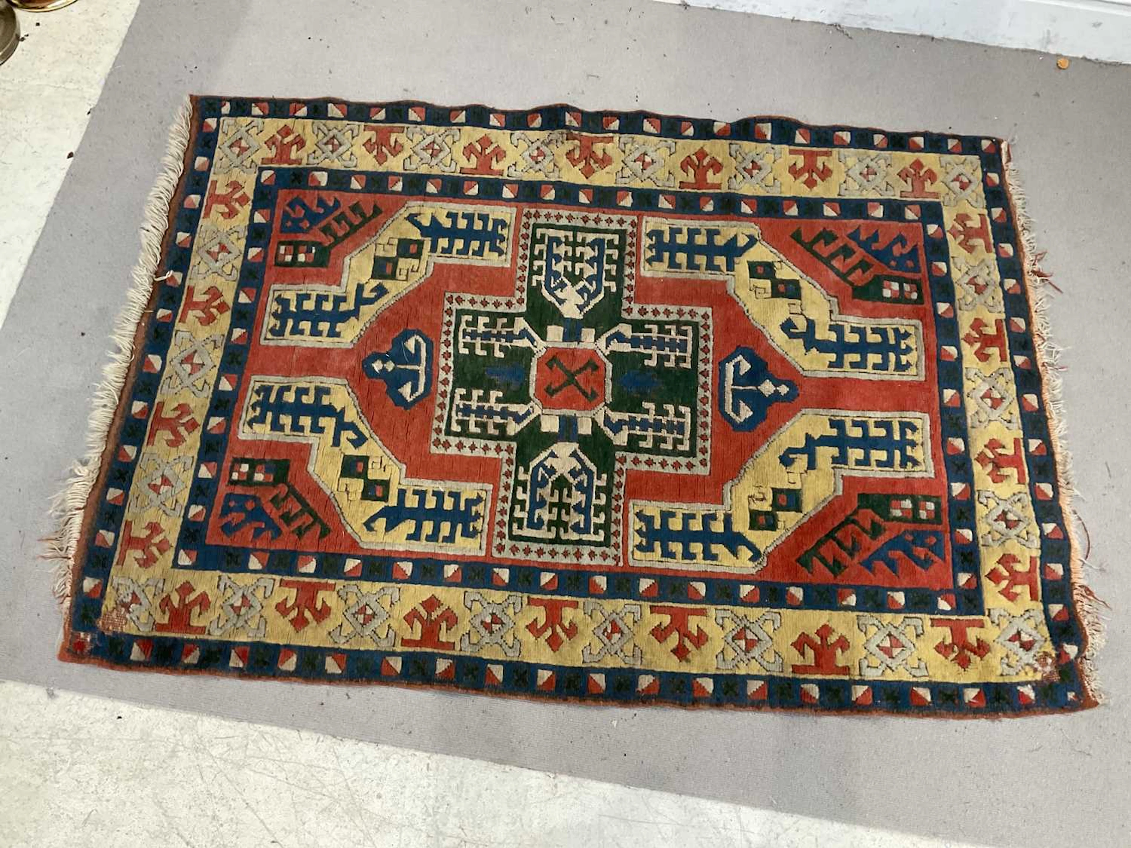 A yellow ground Eastern style hand knotted woollen rug